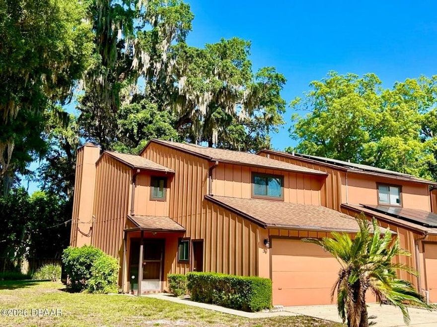 GORGEOUS IN PARK PLACE!!! Beautifully Updated in Ormond! This Move-In Ready 3-bed, 2.5-bath, 2-car garage townhome has a Community Pool!! The unit features Newer Gray Kitchen Cabinets, Stainless Steel Appliances and Subway Tile. Newer Luxury Vinyl Flooring, Gray Bathroom Cabinets, Skylight and 5 1/2 '' White Base Trim throughout add a Lovely Accent! This End-Unit has Fresh Paint, Newer Windows, Wood Burning Fireplace and a Shaded Porch for Relaxing. Newer Roof and Water Heater - 2020. Central Park nearby offers meandering trails, picnic areas, basketball, labyrinth, tennis, basketball and Wonderful Lake Views. Come fall in Love with a great unit and low monthly fees! 2 Dogs or Cats ok. Underlayment was added when Exterior Siding was replaced.