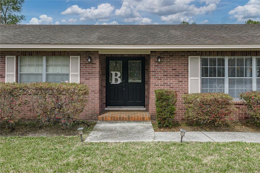 Welcome Home! Motivated Seller relocating to a new town, will have a new roof put on with an executed contract to be done before closing. Spacious 3BD/2BA pool home is situated on an over half acre corner lot. No HOA giving you the benefits of homeownership without HOA restrictions. Entering you will find the perfect blend of space, comfort and independence. With multiple living areas this layout is ideal for both everyday living as well as entertaining. Starting you will find to the immediate right, through French doors, there will be a welcoming space that flows effortlessly into the quite spacious Kitchen and Dining room.  Enjoy an updated Kitchen with 3-year-old stainless appliances, granite counters, an island with additional storage, and eat-in space. The Dining room is equally generous in size, making for a cozy family gathering place. The bedrooms are situated on the left side of the home, creating a nice private retreat away from the main living spaces. The Primary bedroom boasting an En Suite bathroom with a fully tiled walk-in shower. The primary bedroom has sliders that lead you out to the enclosed patio. Moving further into the home, you enter the Living room with built-in features, a fireplace, wood beam ceiling accents, a pass-thru window from the Kitchen, and sliders to the enclosed patio. In the Living room you will start to envision relaxing evenings at home or those fun game nights with friends. As you step out back you will be greeted by the refreshing private pool and added value for outdoor living!  Your backyard oasis will be perfect for relaxing, entertaining, or just enjoying sunny days at home. Multiple upgrades include a new fan and UV lights in the air handler, pool cage added last 18 months, pool pump within last 2 years, and all cabinets in Kitchen and bathrooms are soft close. Enjoy the freedom to truly make this home your own!