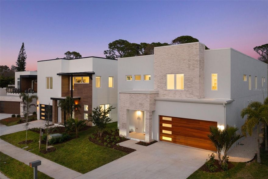 Luxury Brand New Construction that is MOVE IN ready! Tour this exquisite build that is in the heart of everything that Sarasota offers and is over 4240 SQ FT of thoughtful desinged living space.  There are multiple flex spaces, allowing the new owner to customize to their needs. The entry space, with airy 10 FT ceilings and gorgeous designer tile, allows for one of those flex spaces.  The room off the entry could be an office, art room, music room, or formal living space. As you move to the heart of the home you will see the Living Room/ Dining / Kitchen area is all OPEN, yet remains intimate. The Kitchen has an enormous Quartz island at 10x5 with waterfall edges and this Chef's kitchen includes top notch KitchenAid appliances. Additional floor to ceiling cabinet space flanks the kitchen wall for more storage. Top that off with a HUGE Butler's Pantry off the kitchen with 2 sets of cabinet runs that keeps space organized behind beautiful wood cabinetry and Quartz countertops. The dining area is huge at over 21 feet long, with tons of space to host a large gathering and overlooks the pool/spa/outdoor area. The living room wall has designer acoustic slat wall and gorgeous modern lighting. The first floor continues with a bedroom that could easily transform into an office or mother in law suite as it has it's own En Suite bathroom with luxury shower, mirror with dimmable LED light, and Quartz vanity.  The staircase is a true work of art with glass panels for a modern feel.  At the top, another bonus room/flex space beckons, ready for your family's customization as an office, yoga space, tv room...whatever you wish.  Engineered hardwood throughout warms the space and extends into all 4 upstairs bedrooms. The expansive Primary Suite at 22 Ft in length offers a sanctuary for relaxation and privacy, distinct from the rest of the bedrooms. The Primary Bath boasts 8.7 Ft Quartz vanity with dual sinks, soaking tub, large gorgeous tiled shower. Bedroom 3 and 4 have a Jack and Jill, with separate vanities at either end and a generously sized shower in between, so well thought out. The fifth bedroom, sizable 15x18 Ft space with its own En Suite bathroom provides privacy. Upstairs laundry, quite large, is complete with cabinetry, sink, and Quartz countertops. The entire house is fortified with impact windows and sliders, ensuring safety and energy efficiency. A private pool and spa complete this retreat, offering the perfect setting for relaxation and entertainment. 13 minutes to downtown to enjoy the culture, restaurants and boutique shopping of Sarasota and 15 minutes to world famous Siesta Key beach.