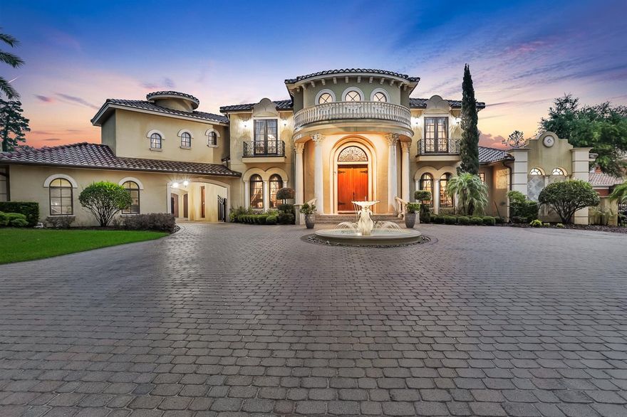 One-of-a-kind Charles Clayton masterpiece perfectly positioned on a 1-acre golf-front homesite in Seminole County's premier 24-hour guard-gated neighborhood of Alaqua.  Highlighting the very best of time-honored architecture and old-world craftsmanship, no detail has been overlooked nor expense spared in the construction of this palatial estate spanning nearly 9,000 square feet.  Arrive via a fully brick-paver drive to incredible 12' tall solid wood double front doors and immediately be amazed by a nearly 30' high ceiling and dual circular stairways in the grand entry.  Featuring 6+ bedrooms, 9 bathrooms(5 full, 4 half), office/library, wine cellar, theater room, billiard room, bonus room, guest house, outdoor kitchen/bar, and much, much more.  Exquisite molding, ceiling treatment, and flooring are everywhere you look; one discovers more with each glance.  The chef's kitchen is ready for home cooks and professionals alike with Viking Professional range, 2 SubZero built-in refrigerators, Miele coffee station, warming drawer, and copious storage - all with hand-made custom cabinetry and solid wood fascia.  The master bedroom on the main level is a destination truly unto itself with oversized sitting area, spa-quality master bath, and massive dual walk-in closets.  Entertaining friends and family alike present seemingly limitless options - enjoy a movie in the theater room, host friends for a dinner party in the game room with built-in custom bar, or relax on the covered lanai amidst a resort-style backyard with sparkling oversized pool and outdoor kitchen, bar, and fireplace!  A detached guest house is ideal for guests staying for an extended period of time and has the flexibility to handle whatever you can dream up.  The home office/library features exquisite custom built-in cabinetry and its own walk-in closet offering incredible storage should the need arise.  A saltwater aquarium splits the family room from the eat-in space in the kitchen, while the home gym features a sauna; perfect for post-workout!  From an elevator helping with access to the second level, to a generator ensuring no power interruptions, everything has been thought of and obsessed over.  Truly too much to list; all with the conveniences of world-class golf, shopping, restaurants, schools, business parks, and highways nearby.  This property may be under audio/visual surveillance.