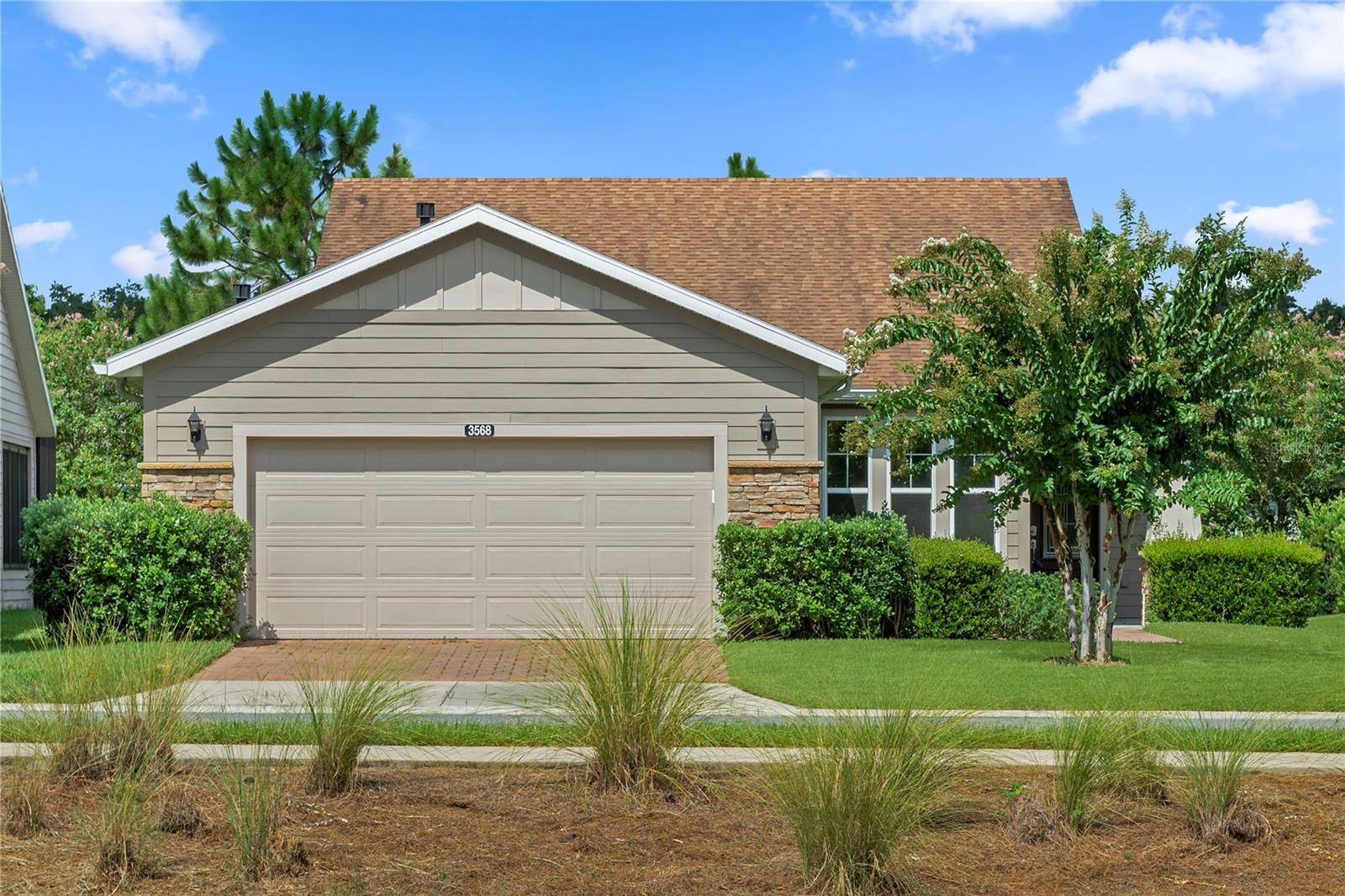 Experience the perfect blend of style, comfort, and convenience in this stunning Shea Built Monaco model in the highly sought-after Ocala Preserve. Boasting an unobstructed front view of the community’s championship golf course, this 2-bedroom, 2-bathroom home with den and a spacious 2-car garage offers over 1,660 square feet of beautifully designed under-air living space. The open, split floor plan maximizes privacy while creating a seamless flow from room to room. Step inside to soaring ceilings, large windows that fill the home with natural light, and thoughtfully selected upgrades throughout. The large, eat-in kitchen features stone countertops, abundant storage, and flows effortlessly into the great room—perfect for both relaxing and entertaining. The primary suite is a private retreat with a large walk-in closet and a spa-like en-suite bath featuring dual vanities, plentiful storage, and a beautifully designed stand-up shower. The guest bedroom is generously sized, with a nearby guest bath offering a convenient shower/tub combo. The versatile den is ideal for a home office, hobby room, or additional guest space. Ocala Preserve is more than just a neighborhood—it’s a lifestyle. Residents enjoy a Tom Lehman-designed golf course, resort-style pool, fitness center, tennis and pickleball courts, scenic walking trails, a dog park, and a full calendar of social activities. Conveniently located near shopping, dining, and medical facilities, and just a short drive to downtown Ocala and Gainesville, this home offers the very best of Florida living. Whether you’re enjoying your morning coffee while watching golfers tee off or entertaining friends in your open-concept living space, this Monaco model is ready to welcome you home.