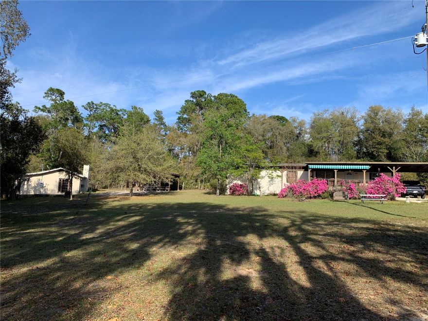 Nestled in the heart of the picturesque Ocala National Forest, two charming homes, 24605 and 24645 NE 177th Ter await their fortunate new owners. Multi Family, TWO HOMES, TWO GARAGES on two separate properties adjacent to each other $199,500 each, total of 3.5 acres to be purchased together priced at $399,000. 24605 and 24645 NE 177th Ter Fort McCoy MLS #TB8433646 and MLS #TB8433651. Welcome to Cedar Landing and the Ocala National Forest!!! Paradise for outdoor enthusiasts... FISHING, HUNTING, ATV and MOTORCYCLE riding, HIKING, CAMPING, BOATING and much more. This unique property offers the rare opportunity to own not just one, but two homes adjacent to each other in one of Florida’s most serene and beautiful environments. This beautiful property is more than just a home; it is a lifestyle. Whether you are looking for a peaceful retreat, a family compound, a place to entertain, relax or simply enjoy the serenity and beauty of nature, this estate has it all. Situated on a sprawling 3.5 total acre property, the first home at 24645 NE 177th Ter is a 952 sqft  cabin on 1.15 acres with one bedroom, one full bathroom, spacious 25x15 family room, open kitchen and dining, 30x10 screened/covered front lanai, 36x16 open side patio, 25x20 detached garage, 17x20 gathering pavilion w/ water and electric, detached 18x10 storage building w/ electric and separate outdoor full bathroom. The 2nd home at 24645 NE 177th Ter is a single wide manufactured home is on 2.35 acres and offers 840 sqft, 2 bedrooms, 1 full bath, 26x10 covered front porch, 24x14 carport, 8x9 covered back porch, detached 33x14 garage/workshop w/ electric and an additional covered front 33x11 and a 33x9 covered back parking or storage area and an additional shed with water and electric. Each home/property has its own well, septic, power meter, garages and driveway. The homes are set back away from the road for added privacy and are surrounded by beautiful mature trees and a rolling landscape. This property is absolutely gorgeous and perfect for families as a weekend getaway, vacation home, primary residence or investment opportunity. The Cedar Landing is a small, quiet and close-knit community with a boat ramp to the Ocklawaha River and within walking distance from the homes. Great location near the Rodman Recreation Area which is known for its excellent fishing opportunities. Quick trip to Ocala, Salt Springs, Silver Springs or Palatka. A true get away in a gorgeous setting!! Encompassing more than 600 square miles in North Central Florida, the Ocala National Forest is bursting with adventure. Hike the Florida Trail, camp in the deep woods, spend a lazy day at a cool, bubbling spring, paddle a spring run, a lake or a river. There are more than 600 springs, lakes and ponds in this forest. The Ocala National Forest ls the second largest nationally protected forest in the U.S. State of Florida. It covers 607 square miles of northern Florida. It is located three miles east of Ocala and 16 miles southeast of Gainesville. The Ocala National Forest, established in 1908, is the oldest national forest east of the Mississippi River and the southernmost National Forest in the continental U.S. The two properties must be purchased together but can remain separate parcels. Easy access to the property, just off the paved road on a hard gravel road (no dirt).
