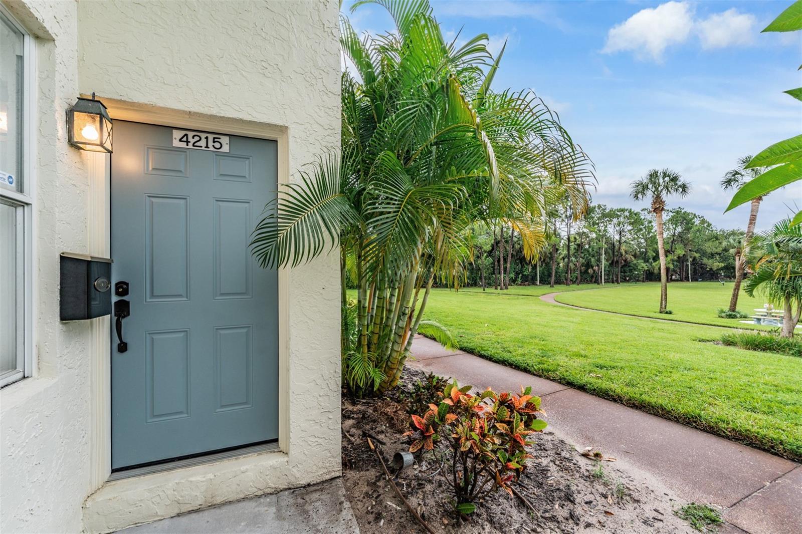 One or more photos are virtually staged. Welcome to this beautifully updated townhouse located in Tampa Villas South! Located on a beautiful park like setting with your door opening up to a 5 acre park in South Tampa (Perfect for Pet Owner)! BRAND New Roof 2025, New extra wide plank LVP Floors, newly updated kitchen and bathrooms are all featured in this townhome. Features an amazing 11 ft accent wall with LED lighting on the stairs and an outdoor patio oasis to relax in the evenings on. The kitchen features a brand-new marble mosaic back splash, new quartz countertops, and a wine fridge. Both bathrooms feature BRAND NEW all wood vanities with beautiful tile accent walls. Upstairs, you'll find two large bedrooms both offering large closets with an additional large linen closet. New remote controlled ceiling fans with multiple mood light settings are in each bedroom. LOW HOA fee of $185 / month! The community features beautifully maintained grounds, a dog park, large walking path and sidewalks throughout, salt-water swimming pool, basketball court, playground, and lighted tennis courts. Great for an investment property with no lease restrictions even short term rentals. Walking distance to Publix, Bank of America, Walmart and just a short drive to anywhere you want to be with quick access to the Selmon Expressway and Gandy Bridge. Great property for dog owners with a huge park out your front door and a fenced off dog park. There is even a dog day care walking distance from the community.