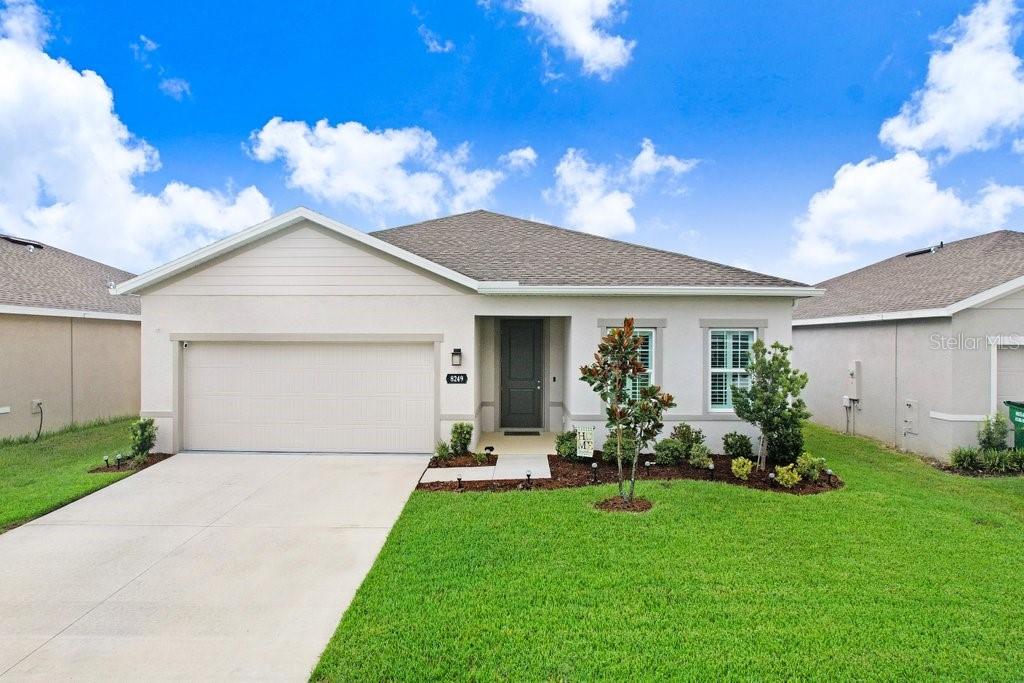 Welcome to this stunning 4-bedroom, 2-bath single-story home built in 2024, perfectly situated in the highly sought-after Park Meadows community. With low HOA fees and No CDD, this home combines modern living with exceptional value & comfort. Step inside to an inviting open floor plan with a split bedroom layout, designed for both functionality and privacy. The home features tile flooring throughout the main living areas, cozy carpet in the bedrooms, abundant natural light throughout, high ceilings, and upgraded plantation shutters for a timeless touch. The kitchen is a chef’s delight with sleek stainless steel appliances, a spacious walk in pantry, ample cabinet space, and gorgeous Quartz countertops. The spacious primary suite offers a large walk-in closet and a spa-inspired bathroom with a walk-in shower as well as his and her sinks with additional space for a vanity station. The additional three bedrooms are perfectly situated for a kids's room, guest room, or even a home office! The extra bathroom includes a tub, his and her sinks, and its own spacious linen closet. The 2-car garage has been upgraded with epoxy flooring to provide durability and a polished finish. Apart from provinding exceptional homes, the Park Meadows community also includes a community pool perfect for sunny Florida days and a dedicated dog area for your four-legged friends. This home’s location is unmatched- across from Cypress Creek schools, just 2 miles from the new Johns Hopkins Children’s Hospital, and only 4 miles from the Epperson Lagoon! This move-in ready home offers modern living, fantastic amenities, and a convenient location in one of Wesley Chapel’s most desirable communities — schedule your showing today!