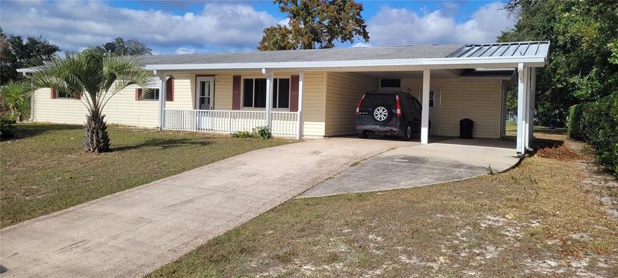 SENIOR HOUSING 55+ House interior freshly Painted ,2 Bedroom 2 Bath, Double Carport, Large Utility Room,  Walk in closets.   Close to Shopping and Restaurants, 2 Active Clubhouses, Separate 10 x 33 Lanai With a Mini Split unit ( For AC and Heat),also a Screened Porch, Formal Dining Room, Large Dinette and on a Corner Lot