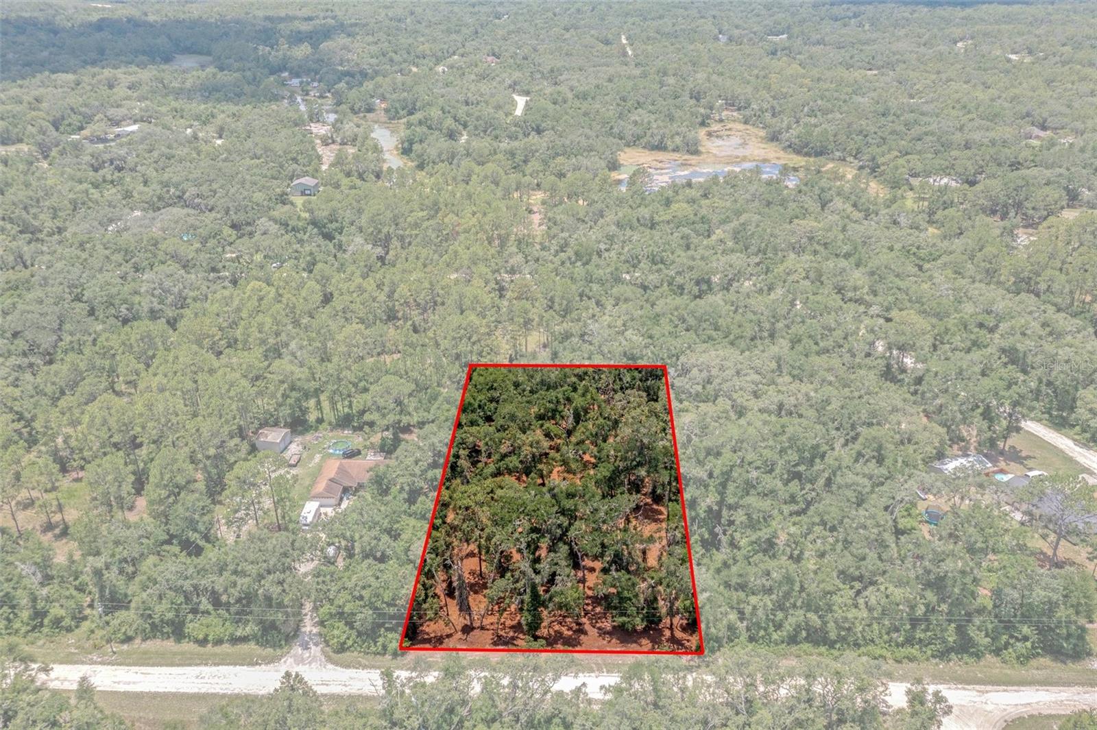 FRESHLY FOREST MULCHED AND READY TO BUILD! HIGH AND DRY LOT, NO FLOOD ZONE, 1.16 acres, flat, and ready to build on! Lightly wooded and private parcel to build your dream home. Located on Ruby Ave, minutes to Treiman Blvd (US 301) with No HOA, no minimum time to build. Electric on property line, bring your boats, campers, work trucks and toys! Site built and modular homes only, no manufactured homes under current zoning. Call for more information!