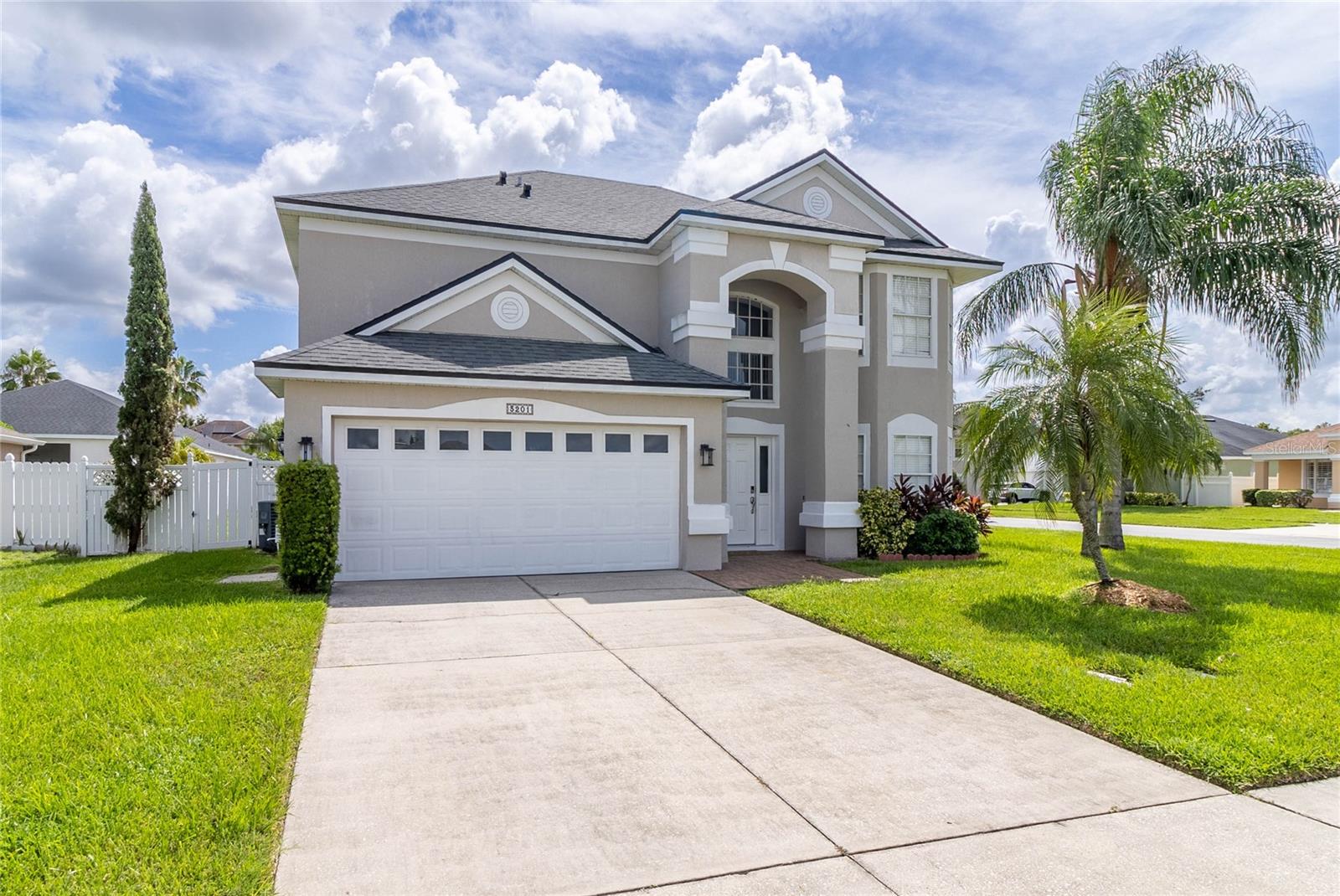 Welcome to this beautifully updated home offering a spacious and functional layout in a prime location. Step inside to find new flooring throughout, a formal living and dining room, and a large family room that opens to the kitchen, creating the perfect space for entertaining. The kitchen features stainless steel appliances, granite countertops, and ample cabinetry. The primary suite boasts a tray ceiling and a fully remodeled bathroom with a double vanity. A generous open loft provides additional living space and could easily be converted into a 4th bedroom. Bay windows in both the living room and loft bring in natural light and add charm to the home. Enjoy the outdoors in the fully fenced backyard on almost a quarter acre, complete with a covered and screened lanai with ceiling fans. Large windows throughout fill the home with light, creating a warm and inviting atmosphere. Located within walking distance to The Loop with shopping, dining, and entertainment, and just steps from the community pool and playground, this home combines comfort, convenience, and style.