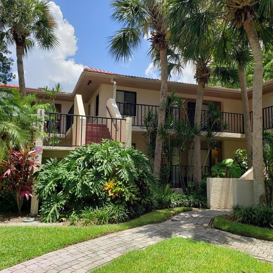 You deserve this! Welcome home to your private sanctuary at Wild Oak Bay, where comfort, style, and serene lake views come together effortlessly. This beautifully updated two-bedroom, two-bath condo invites you to unwind the moment you step inside. The thoughtfully designed kitchen features sleek steel-front appliances, stone countertops, and a cozy eat-in area, ideal for everyday living or casual entertaining. Throughout the home, crown molding and laminate flooring add warmth and continuity, while a dedicated wine refrigerator alcove adds a touch of sophistication. Your favorite space may be the raised-floor Florida room, offering uninterrupted views of the tranquil lake—perfect for morning coffee, evening relaxation, or hosting friends. Just beyond, a covered open balcony overlooks the water and soothing fountain, with stairs leading directly down to the lush backyard. The primary bedroom is a peaceful retreat with a walk-in closet and glass double doors opening to the Florida room. The ensuite bath features a spacious walk-in shower for easy, comfortable living. The guest bedroom is equally welcoming, complete with its own walk-in closet and adjacent bath with a tub/shower combination. Located in the desirable El Conquistador neighborhood, residents enjoy proximity to IMG’s championship golf course, clubhouse, and public restaurant, with IMG Academy and the State College of Florida just minutes away. Best of all, the area’s beautiful sandy beaches are only five miles from your door. This is more than a rental—it’s a lifestyle.