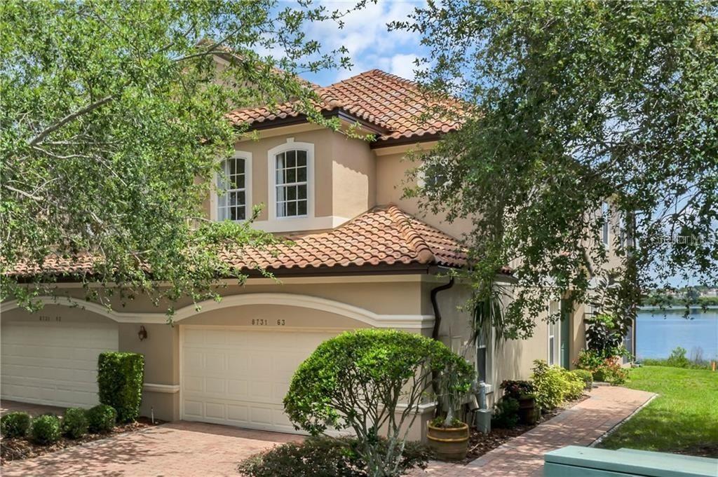 LIVE LAKESIDE LUXURY — MOVE-IN READY! Step into the serene elegance of Vizcaya Heights, one of Orlando’s most exquisite gated communities. This stunning 3-bedroom, 2.5-bathroom waterfront END UNIT villa is available now for occupancy beginning 9/1/25., It offers the perfect blend of style, space, and sophistication. Wake up every morning to breathtaking water views and enjoy your evenings with the gentle breeze off the lake—visible from nearly every room. This spacious two-story villa features 10-foot ceilings, rich hardwood flooring, and designer touches like tray ceilings and custom ceiling fans throughout. Natural light pours into the expansive living and dining areas, while the gourmet kitchen boasts granite countertops, a center island, stainless steel appliances, a pantry, 42-inch cabinetry, and both breakfast bar and cozy dinette. Upstairs, your private master retreat awaits—complete with serene lake views, dual walk-in closets with custom organizers, and a luxurious ensuite bathroom featuring a dual vanity, jetted spa tub, and a large walk-in shower. Enjoy your morning coffee or evening wine from the screened balcony, where the lake becomes your personal backdrop. All three bedrooms are located on the second floor, along with a versatile loft space—ideal for a home office, reading nook, or creative studio. A laundry closet with extra shelving is conveniently located downstairs. The home also features an attached two-car garage and ample guest parking nearby. Outside, enjoy peaceful moments on the screened-in lanai—a perfect spot for entertaining or relaxing. Lawn care is included, giving you more time to enjoy everything the community and surrounding area has available. Residents of Vizcaya Heights enjoy 24-hour guarded gate security, access to a clubhouse, fitness center, resort-style pool & spa, and tennis courts—all impeccably maintained. You’ll be steps away from Orlando’s acclaimed Restaurant Row, grocery favorites like Whole Foods, Trader Joe’s, Publix, and the Dr. Phillips Library. Walt Disney World, Universal Studios, SeaWorld, top-rated schools, and world-class shopping are all within 5 to 15 minutes. Don’t wait—schedule your private showing today! Homes like this in Vizcaya Heights rarely become available, and this one will go fast.