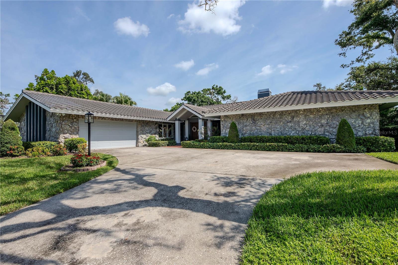 Welcome 2343 Kings Point! A impeccably maintained 4 bedroom, 3 bathroom home with a 2 car garage, offering over 3400sqf of living space in a highly sought after *non flood zone*, all just 8 minutes from Indian Rocks Beach. Situated on more than a half acre, this home features an enormous pool and a sprawling back yard-ideal for entertaining, relaxing or enjoying the Florida lifestyle in total privacy.
Inside, you'll find two expansive living areas that include a wood burning fire place, a separate dining area and a flexible layout that suits families of all sizes. One of the many highlights being the chefs kitchen that has everything you could possibly need with endless storage. This home has been lovingly cared for over decades by one owner, with key updates already completed including the roof, air conditioner and water heater. This is a rare opportunity to own a well-kept, move in ready property that combines space, confort and convenience all in a tranquil location just minutes from the beach, shopping and top rated schools.