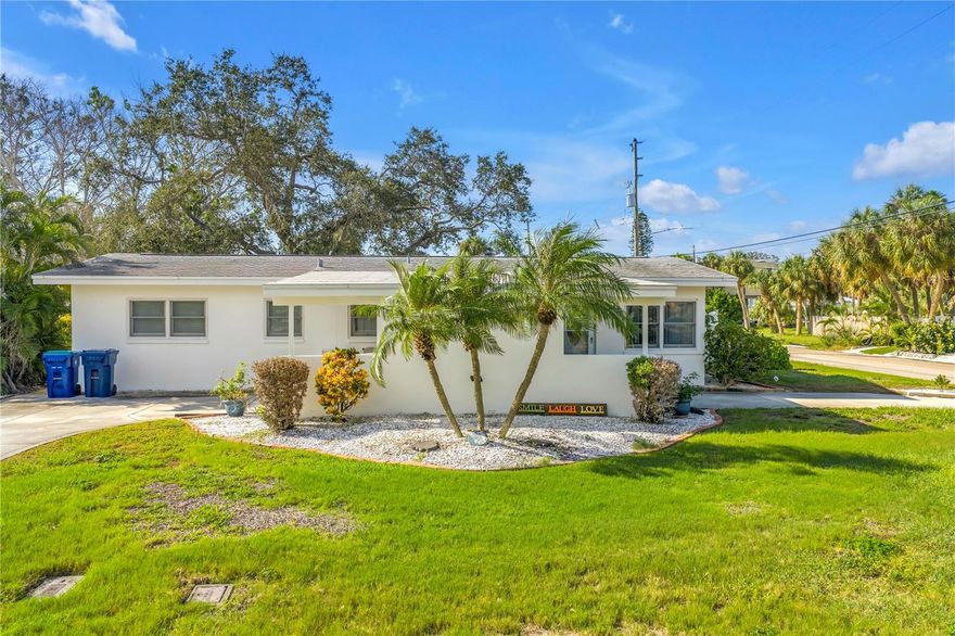 Beautiful remodeled home in Belle Vista, just Steps away from St. Pete Beach

Live the beach lifestyle in this beautifully updated 3-bedroom, 2-bath block home, ideally located in the peaceful Belle Vista neighborhood.

Situated on a spacious corner lot, the home welcomes you with a circular driveway and charming curb appeal. Park under the covered carport and step into a bright, open-concept living space featuring luxury vinyl plank flooring and abundant natural light.

The kitchen is perfect for entertaining, with a peninsula offering bar seating, ample counter space, and generous storage. A nearby hallway leads to a convenient laundry closet and a modernized guest bathroom.

All three bedrooms, including a private primary suite, include built-in closets. Open the sliding glass doors to a screened lanai with a covered lounge area and a newer hot tub (installed in 2019), all overlooking backyard oasis with a brand new fence.

Enjoy the landscaped yard with multiple fruit trees, fresh exterior paint, and plenty of space to relax or entertain. Additional highlights include a large storage shed, a carport closet for extra storage, a whole-house generator (2020), newer HVAC system (2018), impact windows, a 7 stage osmosis water filter, and a tankless water heater for energy efficiency and peace of mind.