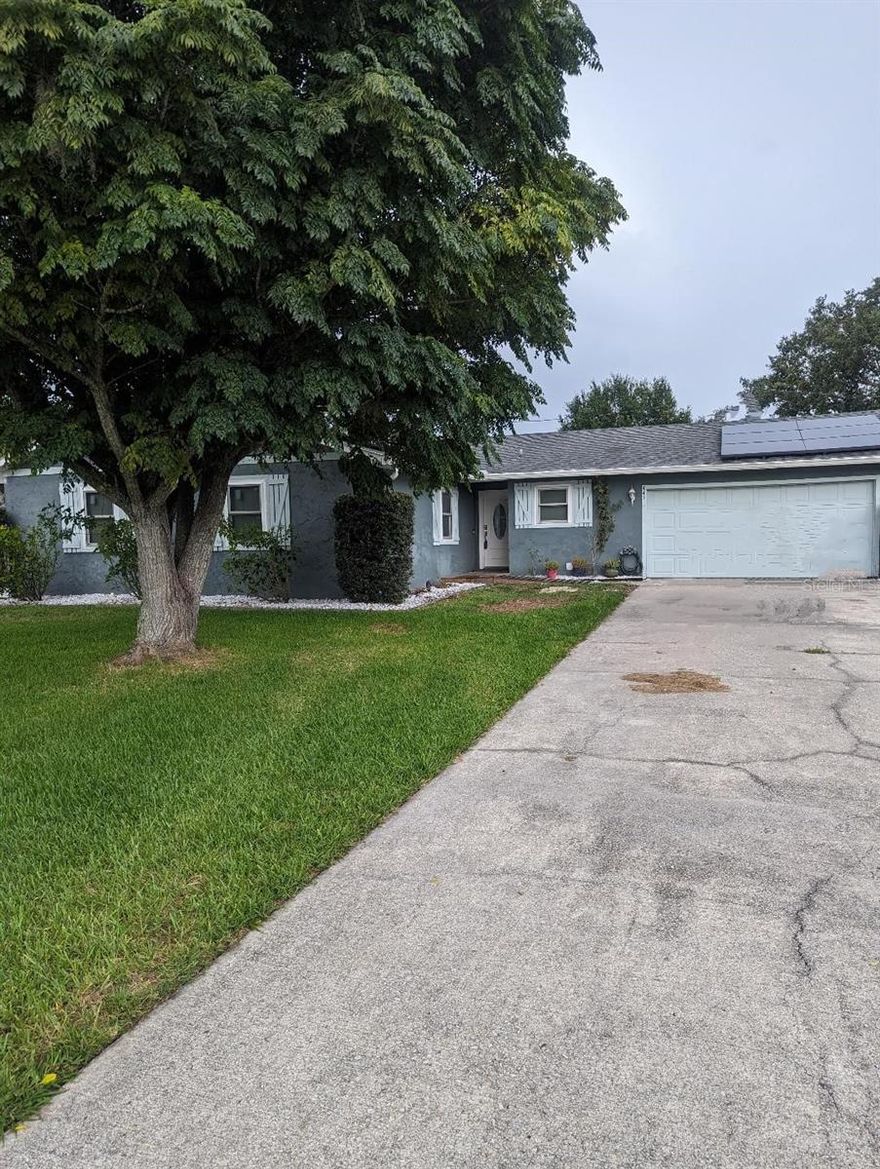 Come on home to your new solar home. This quiet 3-bedroom 2 bath home has plenty of room for entertaining and a 4 ½-foot 20-foot round above ground pool. This well-loved home is just 5 blocks from the beautiful saint cloud lakefront, providing easy travel to enjoy summertime activities at the lakefront. Move in ready with freshly painted walls and BRAND-NEW wood appearance porcelain floors throughout the home for easy clean up. Updated guest bathroom and a tankless hot water heater. Large, fenced yard for the young ones or pets on 2 corner lots, meaning only one side neighbor! Year old Crepe Myrtles in the front yard have the potential to be over 18’ and provide lots of shade from the afternoon sun.  This beautiful home is also 14 blocks from Historic Downtown Saint Cloud and lots of shopping.  Minutes to turnpike and Lake Nona.  Solar panels to be paid off at closing! This home is waiting for you to move in tomorrow.