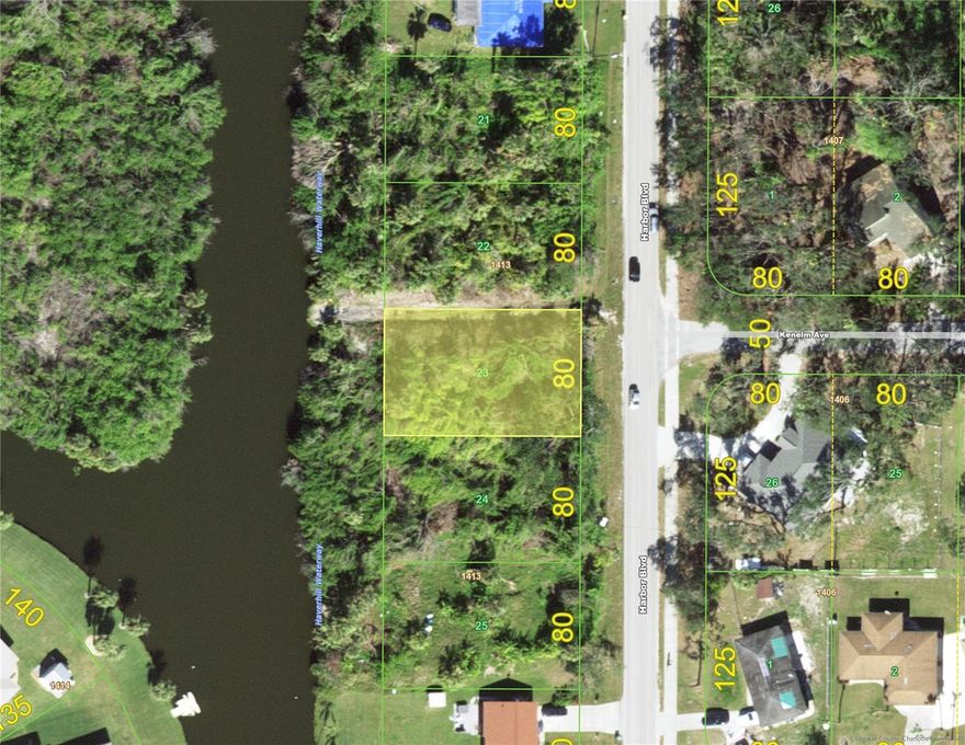 Extra nice fresh waterfront lot on the Haverhill Waterway with CITY WATER and SEWER, located near intersecting waterways and across from a small island that provides a lovely verdant view as well with extra desirable privacy to the rear. Situated within minutes to shopping of every kind as well as dozens of restaurants for every preference, this is an extremely convenient location which boasts a location near the commercial hub of Port Charlotte, Murdock, where amenities of all kinds are readily available. If you are a beach lover you may also take a leisurely ride to the pristine gulf beaches of Boca Grande or Manasota Key. This centrally located property offers the advantages of a well -established neighborhood, yet the surrounding lots are yet to be developed so the adjacent lots will also be developed in the future.