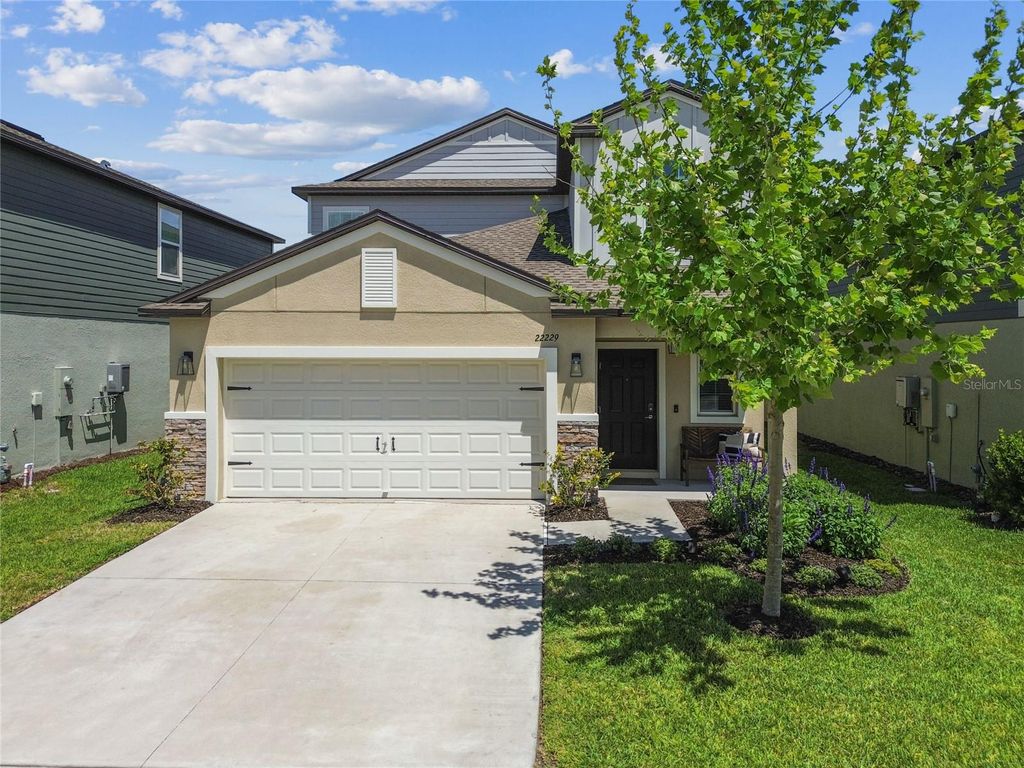 Photo of 22229 Storybook Cabin Way, Land O Lakes, FL 34637 (MLS # TB8366836)