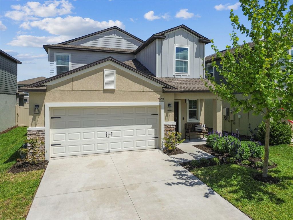Photo of 22229 Storybook Cabin Way, Land O Lakes, FL 34637 (MLS # TB8366836)