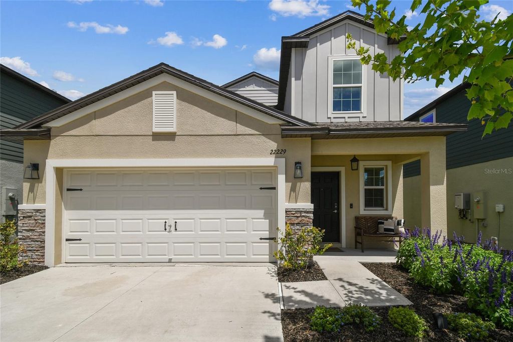 Photo of 22229 Storybook Cabin Way, Land O Lakes, FL 34637 (MLS # TB8366836)