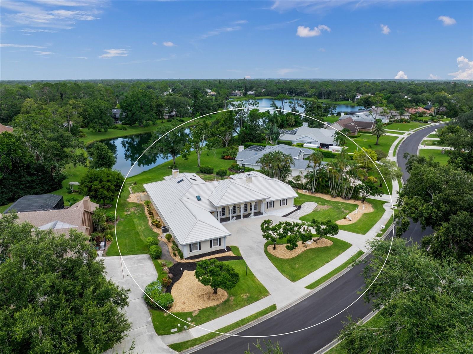 This is the one * LOCATION, LOCATION, LOCATION * 'A' RATED SCHOOL DISTRICT * RARELY AVAILABLE IN THE GATED WOODLANDS OF BENT TREE * NEW Tile Roof 2018 * This Executive Family Home boasts a VERY PRIVATE SETTING ON OVER 1/2 ACRE and BACKS TO A LARGE SPRING-FED LAKE * Quality built home features 5 Bedrooms + 3.5 Baths + 3 Car Side-load Garage with a large circular driveway * Split Plan Design * Formal Living Room with a Wood-burning Fireplace * Formal Dining Room * The large Chef's Eat-in Kitchen opens to the SPACIOUS Family Room * Don't miss the next Movie Premiere in your PRIVATE HOME THEATER! * Your generously-sized Primary Suite showcases a Spa-style Bath with dual sinks, a garden tub, a large walk-in shower with custom fixtures, and a walk-in closet * This is NOT a cookie cutter home * This custom home brings in an abundance of natural light with Transom Windows above the many French Doors and Sliding Glass Doors * ALL OF THIS WRAPS YOUR OUTDOOR OASIS WITH A LOVINGLY RENOVATED POOL & SPA WITH NEW PAVER DECK & 2 COVERED LANAIS * NEW GUTTERS * CUSTOM PLANTATION SHUTTERS THROUGHOUT (including in garage) * This is the perfect home for entertaining or simply relaxing in your private slice of paradise * Stunning curb appeal & custom landscaping * Expansive Back yard & Side yard * 'A' RATED SCHOOL DISTRICT * Short drive to World Famous Siesta Key Beach * 20 minutes to UTC Mall and even downtown Sarasota * Close to shopping & dining * One look & you'll fall in love! *