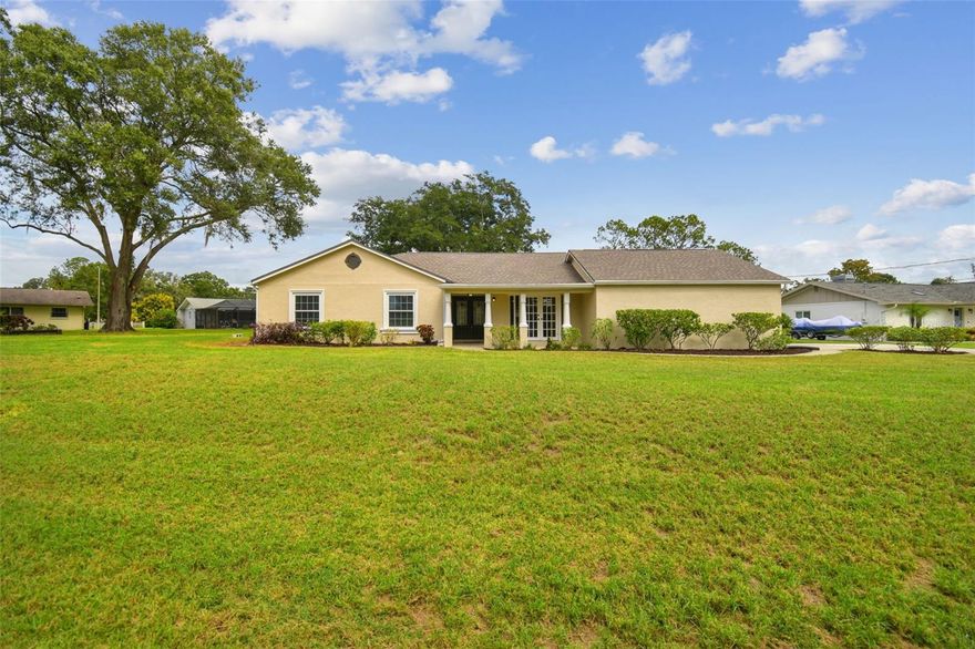 Welcome to this stunning 4 bedroom, 2 bath home in highly sought-after Lake Padgett Estates, just steps from the lake! This fully remodeled residence sits on a generous pie-shaped lot offering excellent curb appeal, an oversized driveway, and a large backyard with a covered porch and storage shed. Inside, you’ll find a bright open-concept floor plan featuring new flooring, baseboards, recessed lighting, and upgraded windows throughout. The heart of the home is the chef’s kitchen with a massive island, soft-close cabinetry, modern fixtures, and a spacious dining area that flows seamlessly into the living room. The primary suite is a true retreat with a beautiful ensuite bath showcasing double vanities, all new tile work, and a walk-in closet. Additional highlights include a split-bedroom layout, an updated guest bath, and a large laundry area with pantry access. Enjoy peace of mind with a new water system, pressure tank, and updated mechanicals, all thoughtfully shaded and tucked away. With easy access to the lake, local parks, shopping, and dining, this home blends modern comfort with Florida lifestyle living. This beautiful community has access to 4 private Lakes: Lake Padgett, Lake Saxon, East Lake and fishing Lake Joyce. Basketball and volleyball court, Child playground, Boats Ramps and BBQ Grills. All the amenities are completely private. (No access to the public) This is a golf cart community and No HOA'S (Roof 2014) (a/c 2023) (Water system 2024).