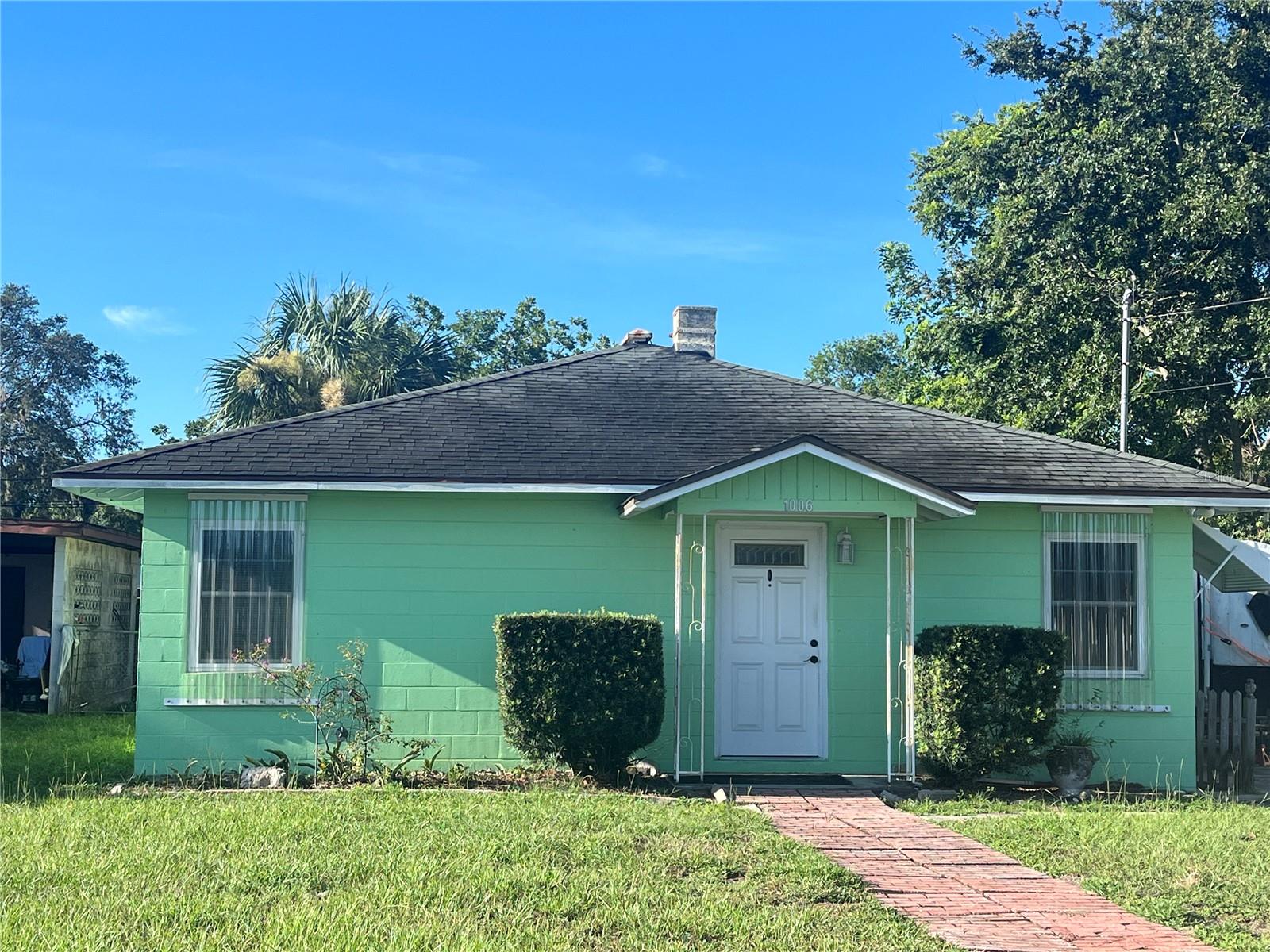 Great bungalow with a large 18 x 35 metal hobby/workshop in fenced back yard also a smaller workshop. Back yard has an inside fenced in area. This is a solid built home with 2 Bedrooms and 1 Bath, new ac 2024 and a tankless hot water heater, dishwasher, Washer and Dryer stay and currently work so they are in "as is" condition. Small chest freezer stays with house. No other appliances. Double pane windows with hurricane shutters. This home has a lot of storage inside and outside. Vinyl plank flooring. Ikea kitchen cabinets, farmhouse, large utility room.