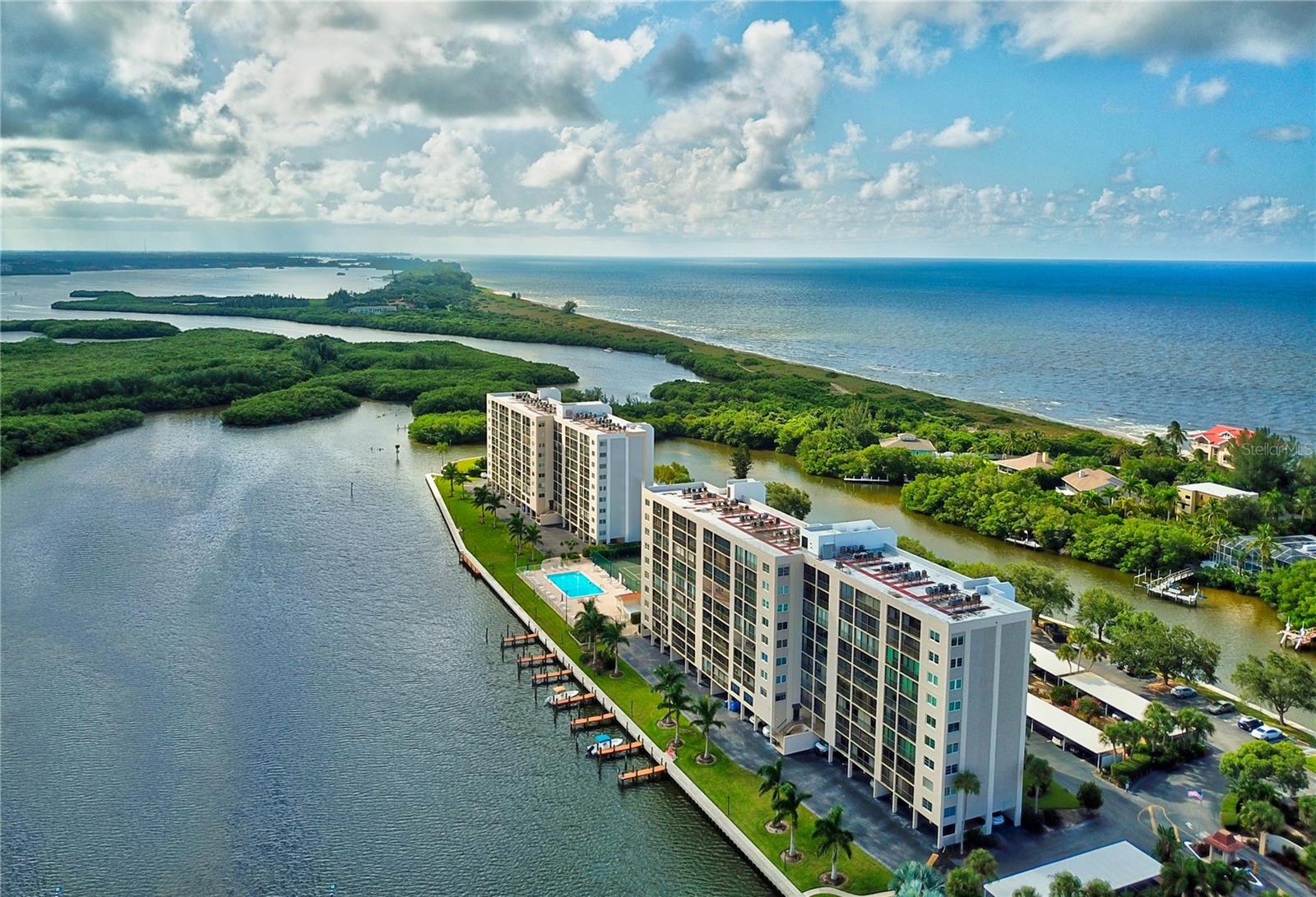 SIESTA KEY WATERFRONT. STUNNING SUNRISE/SUNSET & WATER VIEWS. **Gutted and beautifully renovated two-bedroom, two-bathroom 1630 square feet 7th-floor end unit condominium. in 2022, the owners and contractor utilized every inch of space AND took full advantage of the unrivaled water and nature views. To appreciate the attention to detail and all that is offered, this is truly a “must-see”.** Situated on prime waterfront Siesta Key real estate, THE POINTE is a peaceful gated pet-friendly community offering boat docks, tennis and pickleball, heated lap pool, walking trail, BBQ grills, fishing, on-site management and more! * Larger of the two-bedroom floorplans at The Pointe, this beautifully renovated condominium provides picturesque views from every window! You and your loved ones will enjoy watching Siesta Key’s famous sunsets over the Gulf of Mexico as you sip your favorite beverage seated around the generous island in the spacious open-concept kitchen with quartz countertops, stainless appliances, under cabinet lighting, abundance of cabinetry and storage, hidden outlets, and soft-close cabinet doors. And, if sunrises are your thing, wake up to the spectacular sun coming up over Sarasota Bay and Jim Neville Nature Preserve right from bed OR while settled on the spacious enclosed lanai. The primary bedroom with access to the lanai overlooking the bay offers a fabulous ensuite bath with double sinks, and a walk-in closet with a convenient laundry pass through. The guest bedroom – also with glorious bay and sunrise views – has convenient access to the guest bathroom and lanai, which houses another added storage closet. **MOVE RIGHT IN, THE WORK IS DONE. There is a new HVAC system includes new ductwork with integrated UV air purifier and Smart thermostat. New water heater. New plumbing and electrical within unit. New luxury vinyl and tile flooring throughout. Shiplap and coffered ceilings with recessed LED lighting. Beautiful custom tiled baths. Hard to find in most condominiums is a separate laundry room with space for a second refrigerator or freezer! And don’t forget about parking - made convenient with a desirable OVERSIZED (and coveted) under the building parking space with easy access to your separate ground floor storage area which comes with the unit. **THE POINTE is a private gated community offering the best of both worlds: activity and exercise, plus peace and tranquility. The property encompasses 5+ acres of waterfront property and offers amazing amenities. Outdoor, fresh-air walkways to each unit. Boat docks w/electricity and water. Walking trails. Kayak/canoe launches. Heated outdoor lap pool. Spa. Tennis and pickleball courts. Dog walk. Strategically placed benches. Open-air gazebo w/BBQ grills. Cottage with full catering kitchen. Bike storage rooms. Separate entertainment rooms. A fitness center in each building. On-site management. ADVANTAGEOUSLY LOCATED. Nearby you will find fine and casual dining, Turtle Beach, a full-service marina, a campground on the beach nearby, shopping, coffee shops, grocery, nightlife, entertainment, Siesta Key beach, public transportation and much more - all on Siesta Key. ** Own a piece of paradise and watch the dolphin, manatees, birds, and sea life, fish off the dock, relax by the pool, play an invigorating game of tennis or pickleball, and watch the sunrise AND sunset privately, and quietly, from home.