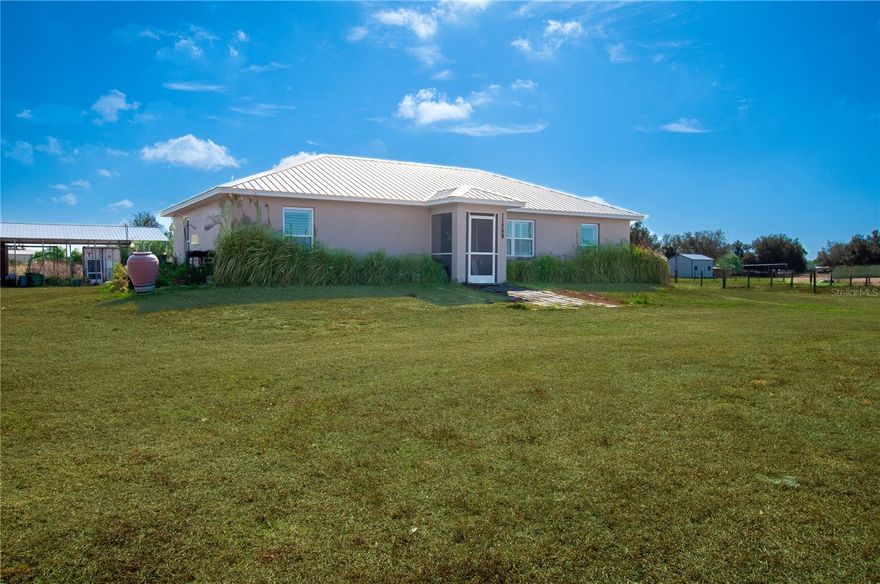 Welcome to your private slice of Florida paradise in Sunnybreeze 
Built in 2019, this beautifully designed 3 bedroom, 2 bathroom home offers over 1,600 square feet of thoughtfully laid-out living space with a desirable split floor plan that provides both comfort and privacy.
Step inside to an open and inviting main living area that seamlessly connects the kitchen, dining, and living spaces — perfect for entertaining or enjoying quiet evenings at home. The spacious primary suite is tucked away on its own side of the home, creating a true retreat with ample room to unwind. Two additional bedrooms and a full bath are located on the opposite side, ideal for guests, family, or a home office setup.
Outside is where this property truly shines. Situated on 5 beautiful acres, the land is cross-fenced, offering flexibility for livestock, horses, or simply defined pasture space. A large pole barn provides covered storage for equipment, trailers, RVs, boats, or recreational toys — giving you the functionality every rural property needs.
Enjoy the peaceful setting and wide-open skies while benefiting from the convenience of DeSoto County taxes. Located in Sunnybreeze, you’re just a short drive to Charlotte County amenities, including shopping, dining, and access to the Peace River and nearby Gulf waters.
If you’ve been searching for newer construction, acreage, and room to grow — all in a prime location — this property delivers the best of country living with everyday convenience.