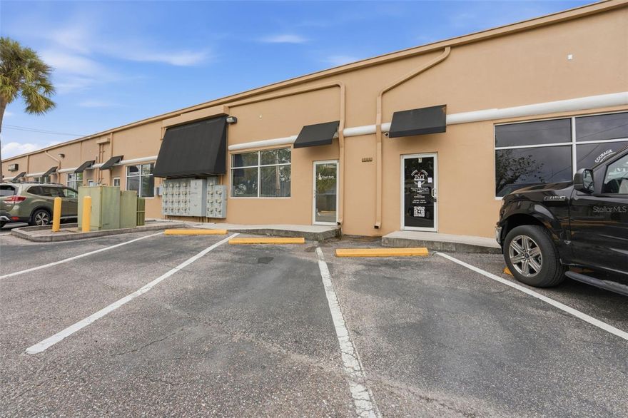 Turnkey Office condo available for sale in the Stars and Stripes Commerce Park, positioned along the Hillsborough Avenue corridor at the intersection of Hoover Blvd. and Hillsborough Ave., less than 1 mile east of the Veterans Expressway and a 10 minute drive from TPA!
This 1,080+/- SF suite offers a clean, modern interior with a flexible layout. The space is designed with an open work area that can accommodate multiple workstations, along with a separate conference room for meetings & team collaboration. A kitchen and private restroom are also included, creating a practical and self-sufficient office setup. Interior updates include newer flooring and
fresh paint, and the property also benefits from a recently replaced HVAC system (2023). The property is located in a well-maintained
office park offering ample surface parking and easy access for employees and visitors.  The owner is open to including some of the furniture
as part of a sale. Zoned SPI-AP-4, the space supports a wide range of commercial uses- including professional office space, medical-related uses, creative services, and other business operations, making it a strong fit for both owner-users and investors