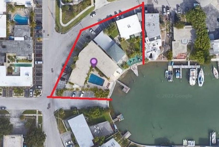 Currently a waterfront motel with 3 buildings - 21 total units - .48 acres - 107 feet of waterfrontage with 2 docks, pool and 25+ off street  parking spaces. Redevelopment site - must verify with city ( 14 condos or 36 hotel rooms ) or keep as a motel . All measurements are believed to be accurate but to be verified by buyer.
