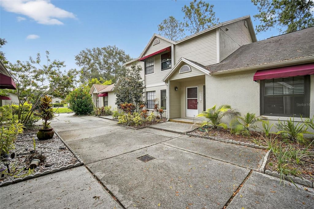 Photo of 8411 Laurelon Place #10-3, Temple Terrace, FL 33637 (MLS # O6342685)