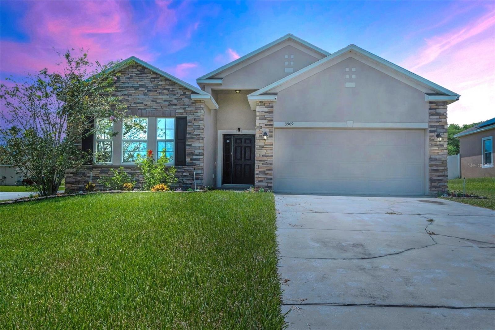 You’ll be impressed from the moment you arrive at this Striking & Captivating home highlighted by stunning brick detailing and situated on a desirable corner lot. Nestled in the highly sought-after Mabel Loop Ridge Subdivision, this 4-Bedroom, 2-Bedroom residence features an oversized yard and a long driveway affording plenty of parking. Upon entering, bask in the beautiful foyer, enhancing the overall aesthetic of the home. The seamless design effortlessly connects the living, dining, and kitchen area, creating an alluring ambiance perfect for hosting guests or unwinding with family. The well-appointed kitchen has all you need to prepare your culinary masterpieces, boasting granite countertops, new sleek stainless-steel appliances, and a breakfast nook. The convenience of a laundry room off the kitchen adds to the practicality of the layout. The Owner’s Suite offers a peaceful oasis to relax and unwind and benefits from a walk-in closet, a private En-Suite Bathroom, with his and her vanity, a garden tub, and a separate stand-alone shower. The additional bedrooms are versatile and perfect for accommodating family members, guests, or can be converted into a home office or gym. Outside you can relish in the privacy of your extended covered lanai by enjoying coffee conversations or a peaceful Florida afternoon. Strategically positioned near US-27, I-4, Disney, Tampa, Orlando, Parks, Shopping & dinning; owning this gem ensures seamless connectivity to the pulse of the city!