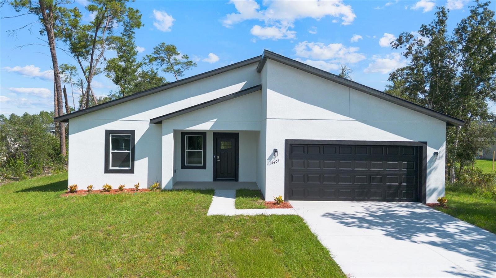 New Construction 4-Bedroom, 3-Bath Home in Ocala, FL
Experience modern living at its finest in this stunning newly built 4-bedroom, 3-bathroom home. Featuring a sophisticated design with wooden slat accent walls, high-end finishes, and an open-concept layout, this home perfectly balances style, comfort, and functionality.
Situated in a rapidly growing area of Ocala, known for its equestrian lifestyle and surrounded by numerous golf courses, this home offers an exceptional lifestyle for families and enthusiasts alike. The generous lot provides ample space for a fenced yard, swimming pool, playground, or any outdoor activities, making it ideal for creating lasting memories with family and friends.
Enjoy the perfect combination of modern luxury, outdoor living, and access to all that Ocala has to offer. Schedule your private showing today and discover your dream home!