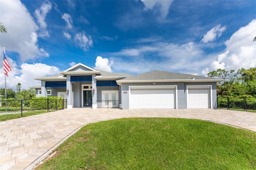 Step into a one-of-a-kind paradise where luxury meets freedom. This custom 3-bed, 3-bath estate sits on over 1.15 acres across 5 parcels, with 240 feet of waterfront and three docks—one with a 10,000-lb lift, two prepped for more. Built in 2019, the home stuns with 12-ft ceilings, grand wooden doors, zero-corner sliders, and uninterrupted views of the saltwater heated pool and Cheshire Waterway. The chef’s kitchen is a showstopper—Sub-Zero fridge, veined granite, high-end appliances, and stylish touches throughout. Unwind in the opulent master suite with pool views, Roman shower, clawfoot tub, and a laundry-connected California closet. Outdoors, enjoy a screened lanai with cedar ceilings, waterfalls, LED-lit pool, and stainless summer kitchen—perfect for entertaining. Bonus? An attached 3-car garage plus a 40x40 detached garage with RV hookups and 16-ft ceilings. With a whole-house generator, electric hurricane shutters, and smart lighting, you’re always ready. Just minutes from dining, shops, and beaches—no hurricane damage, no flooding, no compromises. This is Florida luxury, redefined.