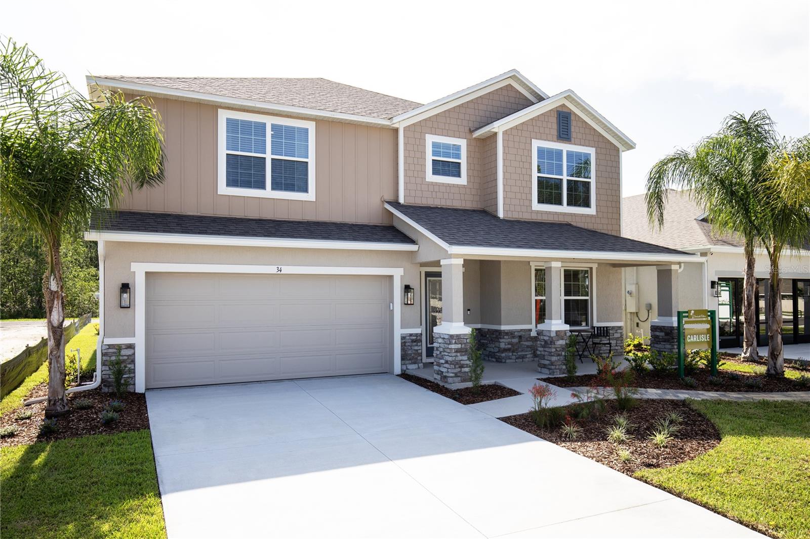 MODEL home offering a sale / leaseback opportunity. The Carlisle in Enclave at Seminole Palms – Where Space, Style, and Functionality Meet!
Located in a brand-new community with resort-style amenities just 10 minutes from Flagler Beach, this move-in ready model home showcases all the upgrades you could imagine. Designed for modern lifestyles, this two-story single-family home blends comfort, efficiency, and timeless elegance in every detail.
From the outside, the stone-accent exterior, covered front porch, and architectural shingles immediately set this home apart. Step through the impressive 6'8" full-lite front door into a beautifully crafted interior with 9'4" ceilings throughout, refined crown molding, and sleek luxury vinyl flooring on the entire first floor and all bathrooms.
The heart of the home is the open-concept great room and gourmet kitchen, designed for both entertaining and everyday ease. The kitchen boasts granite countertops, a large island with built-in shelves, kitchen backsplash, a walk-in pantry, and a full line of stainless steel appliances, including an ENERGY STAR® French door refrigerator. Just off the kitchen is a charming breakfast nook with an additional window, filling the space with natural light.
Adjacent to the foyer is a flex space, ideal for a formal dining room, home office, or den. The great room is enhanced with additional LED lighting and opens seamlessly to the screened-in patio, overlooking a beautifully landscaped yard—perfect for relaxing outdoors.
Also on the main floor is a private guest suite with a full bath featuring a walk-in tiled shower, offering a comfortable retreat for visitors or multigenerational living.
Head upstairs to discover a spacious loft, ideal for a media room, home gym, or workspace, and an iron open handrail with window in stairway that adds brightness and character. Bedrooms 3 and 4 are generously sized and share a Jack & Jill bathroom with dual sinks and a tub/shower combo, delivering both privacy and functionality.
The primary suite is a true sanctuary with a tray ceiling, massive walk-in closet, and a spa-inspired bath featuring an expansive ceramic tile shower wall surround and soaking tub—your own private escape.
The convenient upstairs laundry room includes a washer and dryer, while the 2-car garage offers ample storage space.
This home is fully equipped with smart technology, including a Ring Video Doorbell, Smart Thermostat, Keyless Entry Smart Door Lock, and Deako Switches, offering both convenience and peace of mind. Situated along sidewalk-lined streets, you'll enjoy a walkable, community-focused environment.
Backed by a full builder warranty, The Carlisle is more than just a house—it’s a lifestyle of comfort, quality, and convenience.
Schedule your private tour today and step into your dream home!
