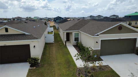 Photo of 3147 Cedar Crossing Boulevard, Haines City, FL 33844 (MLS # O6423914)