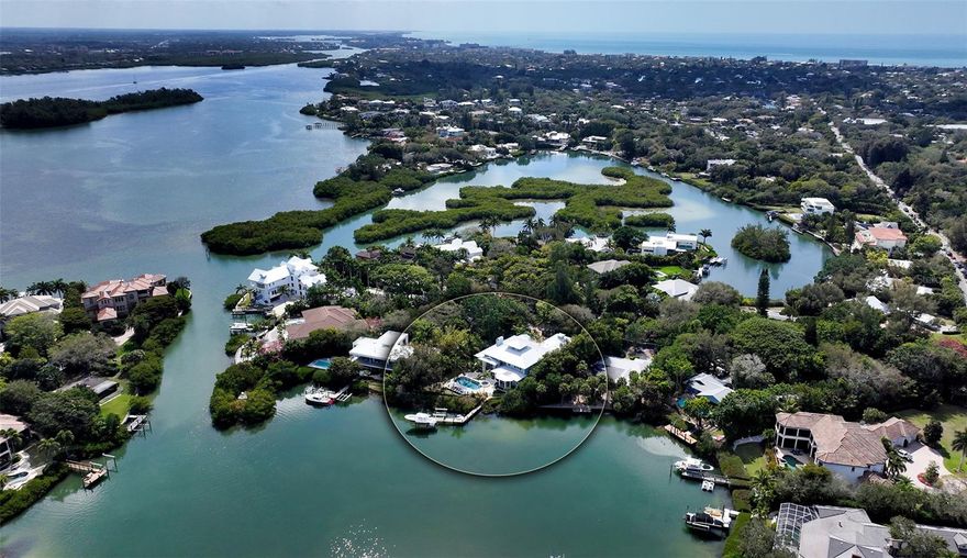 A True Island Estate…This picture perfect home is located in The Exclusive Cocoanut Bayou neighborhood.  An intimate community with estate sized parcels, deep water docks, canopy lined streets and even a gated private beach.  This home was redesigned by Clifford Schultz and could be featured in House Beautiful. The gated parcel is almost 2/3 of an acre, complete with mature tropical landscaping. The home features an oversized Chicago brick motor court with a 3 car side entry garage. The custom wood detailing throughout includes mahogany entry doors, crown moldings, cased impact windows, shiplap ceilings, wainscoting, custom built-ins and more. A gourmet kitchen with Campbell Custom Cabinetry featuring a butler’s pantry, a beverage station, Wolf appliances and an entertaining island complete with additional seating.  The main house has a foyer gallery wall, soaring ceilings, picture perfect views, a Holiday sized living room, a coveted great room, a morning room, a private office, as well as a spectacular Owner’s suite…. all located on the first living level. The owner’s suite has a large sitting area, a spa inspired bathroom and 2 walk-in closets.  The second floor has a hobby room, 3 ensuites and a flex room.  The guest house above the garage has a kitchenette, a great room and an ensuite with private entrance in close proximity to the main home. The outdoor veranda is complete with kitchen, dining and living areas.  The mesmerizing views of the Bayou are ever changing, a kaleidoscope of nature … you will see dolphin, manatee, area fish and seabirds, mangroves and much more.  A resort style pool with travertine pavers, a separate spa, a large garden, and 2 boat docks complete this waterfront lifestyle.  Cocoanut Bayou is minutes to Siesta village for shopping, dining and Siesta’s world-famous beach.  You are close to downtown Sarasota which is known for its cultural significance.  The opera, orchestra, ballet, symphony, performing arts center, art galleries are all at your disposal. Shop, dine or just enjoy the city that embraces it all. Sarasota County really has something for everyone. Selby Botanical Gardens, Mote Marine Aquarium, several nature parks, bike trails, water sports, Polo, sport venues, multiple Universities and the list goes on.  Don’t wait to discover this unique opportunity … It will not last long.
