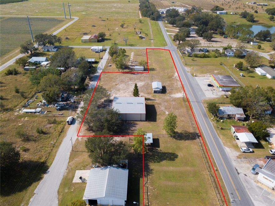 Discover the potential of this versatile 2.64 acre commercial property located in Bartow, the county seat of Polk County and centrally positioned in the heart of Florida. With two buildings and multiple zoning possibilities, this property is ready to accommodate a wide range of business ventures.

The main building offers a professional office setting complete with five private offices, a conference room, kitchen, and bathroom facilities, making it ideal for administrative or client-facing operations.

The second building, a durable 60x40 steel structure, is currently utilized as agricultural support space for tractors, semis, and heavy equipment. Its size and functionality make it perfectly suited for a variety of commercial or industrial needs.

With the property being over 2 acres it also presents an excellent opportunity for storage solutions, including RVs, semis, boats, or other large equipment.

The current owner is willing to sell, the business and the real estate or just the real estate or will consider triple net lease...Asking price is for real estate only! Owner willing to sell business for additional price.