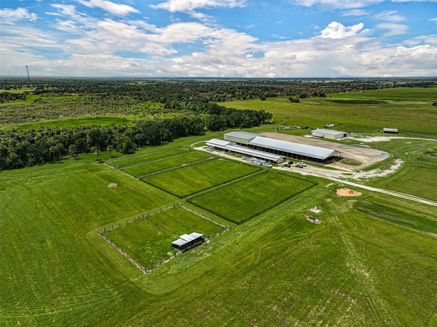 Discover the ultimate rancher's paradise with this sprawling 538-acre estate in the heart of East Sarasota County. Boasting approximately 3/4 mile frontage on both State Road 72 and Harrison Road, this property offers endless possibilities for a cattle or equestrian operation. The land is a nice balance of roughly 80% uplands and 20% ponds, ideal for livestock and outdoor living.

The main home is 4 bedroom 3 bathroom with an office 2847 sqft under air, and salt water pool. The property is fully equipped for ranching with a 205x82 barn (205x60 is covered arena) with 12-foot lean-tos for additional storage, complete with 7 horse stalls, a tack room, and living quarters. An additional shed row horse barn offers 3 more stalls, and pasture with 4 paddocks. For the equestrian enthusiast, the property features a massive 400x175 open arena and a horse walker with cow pens.

Supporting infrastructure includes a 60x80 shop, a 40x60 shop. This ranch has all the amenities needed for a top-tier cow-calf operation, with ample room to expand and customize.

This exceptional acreage is in a conservation easement and within minutes of Sarasota’s vibrant city life. Whether you're looking for an operational ranch or a stunning piece of Florida countryside. Don't miss this unique opportunity! Only 13 miles to TerraNova Equestrian Center, less than 16 miles to Soleta Golf Club and less than 32 miles to Siesta Key Beach!