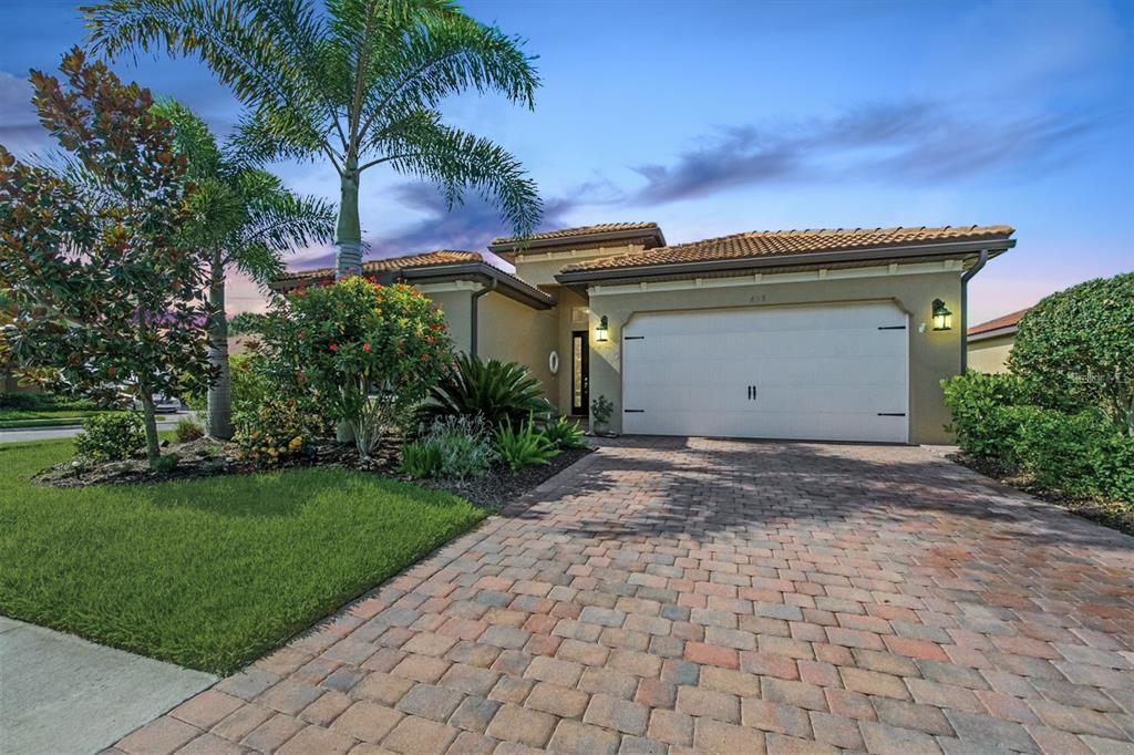 Just a couple miles from the turquoise waters of Nokomis Beach on Casey Key, the boutique neighborhood of Calusa Park beckons you home. This wonderful CORNER LOT home purchased new in 2016 has an open concept floor plan and features granite countertops in the kitchen and both bathrooms, trey ceilings, plantation shutters, Slate 'smudge-proof' GE appliances, custom lighting, ceiling fans in all bedrooms and Great Room, diagonally set tile, and new vinyl plank flooring in bedrooms. Enjoy remarkable SUNSETS past the side VIEW of the LAKE from the screened-in lanai complete with OUTSIDE KITCHEN HOOKUP and EXTENDED paver patio surrounded by lush greenery, palms, oak and pine trees. You can relax by the inviting community pool just down the block or stroll, run, bike the popular Legacy Bike Trail that borders the neighborhood and runs from Venice to Sarasota.
The location is perfect. Besides being just minutes from the beach, Nokomis is located between quaint Downtown Venice to the south and Sarasota to the north. It is about 5 minutes from I-75 and the new Sarasota Memorial Hospital as well. With high-rated schools, shops and dining nearby, this beautiful home will check off your boxes and provide the serene Florida experience you desire! This newer home with custom the ceiling fans, window treatments, lighting, and ultraviolet light in the AC unit has NO EXPENSIVE CDD FEES ATTACHED TO YOUR ANNUAL PROPERTY TAXES. Move in and enjoy!