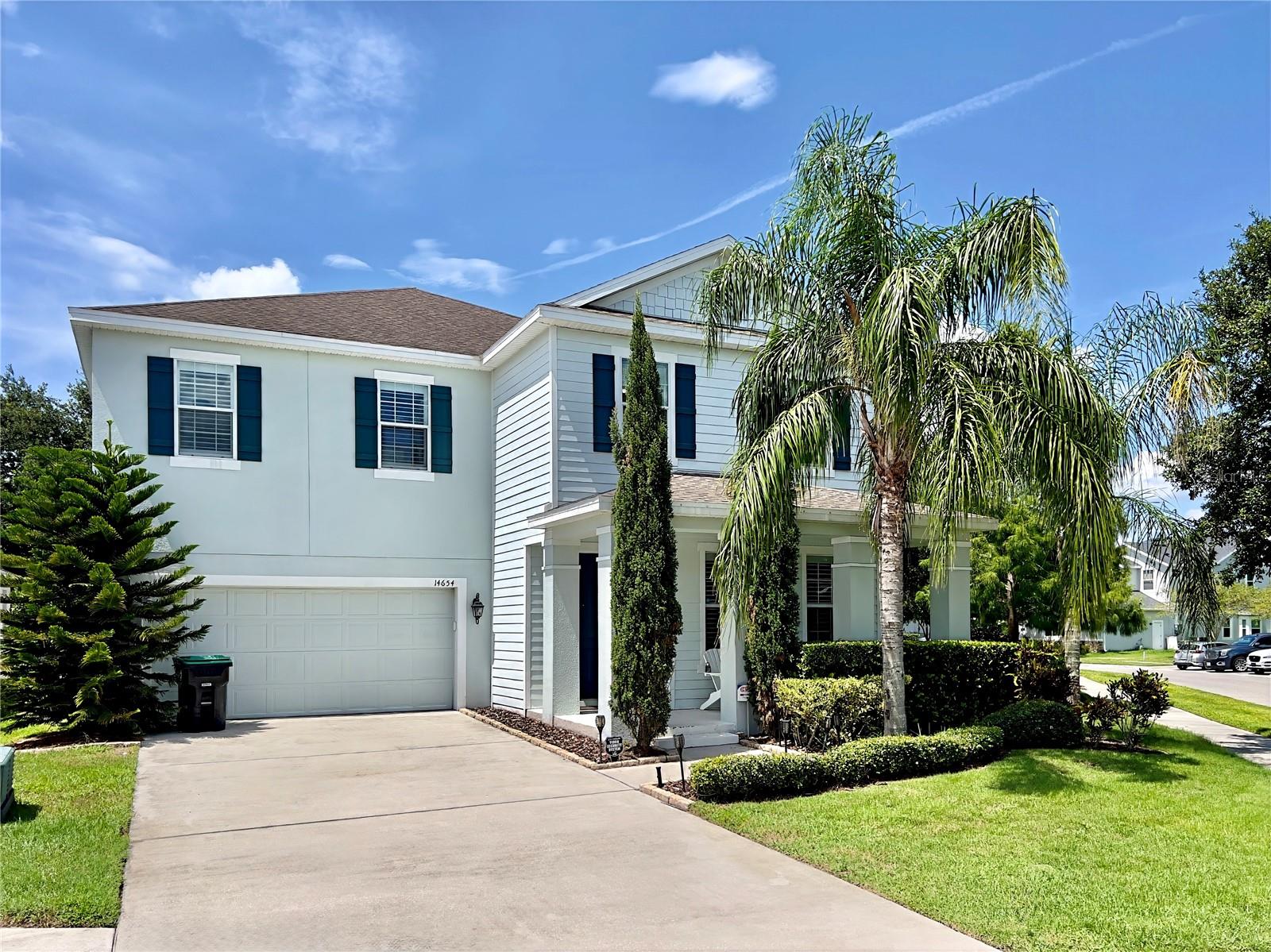 A RARE GEM in Summerport Horizon West! Nestled onto a corner lot with extra space, this lovely home charms with tropical palm trees to welcome you at the covered front porch. Upon entry you're greeted with a stunning open floor plan and soaring ceilings, for a palatial feel. Many windows let in plenty of natural light, and plantation shutters have been installed throughout the home. Not only is there a sizable home office, but also a bedroom on the first floor with an en-suite full bathroom featuring a shower and tub. You have a large kitchen with amble cabinetry, modern stainless steel appliances, and a massive kitchen island that's a chef's dream. There is a butlers pantry passage between the dining room and kitchen for easy access to entertain guests. And just off the kitchen, is a breakfast nook for additional eating space. Upstairs is the palatial primary bedroom, privately situated with a split floor plan from the other guest rooms. You will enjoy TWO primary walk-in closets! A large primary bathroom, with dual undermount sinks, and separate shower and tub. The water closet is enclosed. Down the hall are three good size guest bedrooms, two with jack-and-jill cross-through and one with its own en suite bath. Out from the back porch, beyond your covered lanai, there is an enormous fully-fenced yard with green grass and a shady tree, perfect for social gatherings and outdoor activity. The attached 2 car garage has an extra long driveway allowing multiple vehicles to park, so you can use the garage for storage as needed. This scenic Windermere neighborhood provides residents with parks, playgrounds, and outlets to walk the tranquil ponds. Stillwater community is an easy commute to The Hamlin outlets at Winter Garden and roughly 20 minutes to Disney Springs. 14654 Yellow Butterfly Rd checks all the boxes. Schedule a showing today! And don’t miss our video tour.
