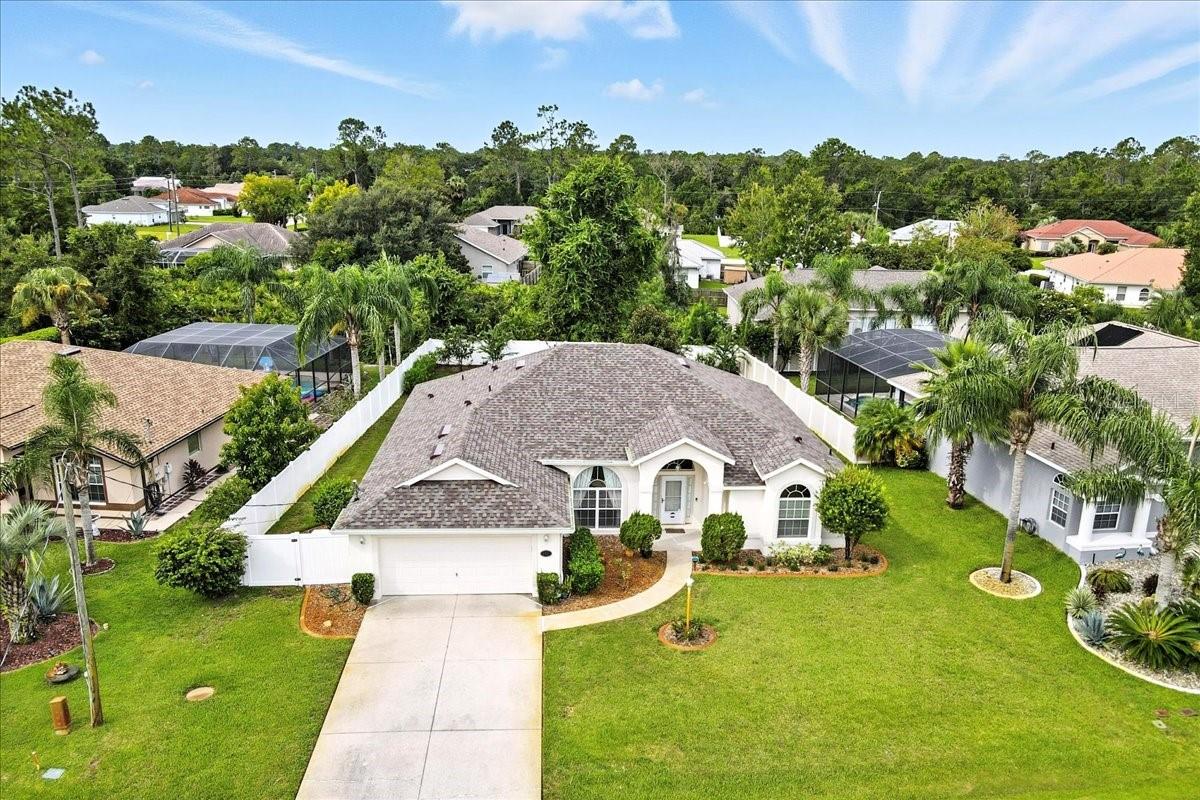 Spectacular Custom-Built Home in Pine Lakes Golf Community
This spectacular custom-built concrete block home is located in the highly desirable Pine Lakes Golf Community, offering over 2,100 square feet of living space with no HOA or CDD fees. Surrounded by beautiful single-family homes, this three-bedroom, two-bath property has been thoughtfully designed and upgraded for both comfort and style.
From the moment you walk in, the soaring ceilings and open split floor plan create a sense of space and elegance. The primary suite is a true retreat with an oversized sitting area, a spa-like bath featuring a garden tub, walk-in shower, dual sinks, and a huge walk-in closet. The spacious family room is perfect for entertaining and flows into a dedicated dining room and a bright, open kitchen with abundant storage and an inviting eat-in area overlooking the lush, landscaped backyard.
The home also features an enclosed Florida room with its own split AC system, ensuring year-round enjoyment. For those who prefer extra cool bedrooms, the two additional bedrooms include an extra AC unit that can be used if needed, providing customized climate control.
Step outside and enjoy your private backyard oasis, complete with mature landscaping, a butterfly garden, full fencing for privacy, a sprinkler system to keep everything green, and plenty of room to add a pool.
Added peace of mind comes with a modern alarm system, a brand-new roof in 2024, a whole-house generator in 2021, and a new central AC system in 2021. All of this is located just minutes from shopping, schools, and restaurants, with Flagler Beach only 10 minutes away—making this home the perfect blend of comfort, convenience, and Florida lifestyle.