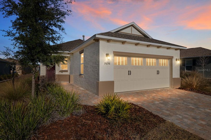 This gorgeous fully furnished 2023 Oren model home, with 2-bedrooms, 2-bathrooms, 2-car garage, located in Longleaf Ridge, On Top of the World, is loaded with builder AND after build upgrades making it BETTER THAN NEW! The location is spectacular with a very short walk to the new Summit amenity center which is currently being built. The kitchen is perfect with shaker cabinets, quartz counters, stainless steel appliances, gas range and tile backsplash. The shaker cabinets also feature crown molding and a lazy Susan. The main bedroom features a custom walk-in closet and an en-suite bathroom with quartz, dual vanity sinks, frameless shower, and designer tile. The main living space features tile, crown molding, tray ceiling and a beautiful ceiling fan to complete the luxury feeling of this home. Enjoy the screened lanai for your peaceful morning cup of coffee. Longleaf Ridge is conveniently located near the Arbors amenity center as well as the future Summit amenity center. Located in Ocala's premier, gated, active 55+ community, loaded with amenities, including golf cart access to two shopping centers.