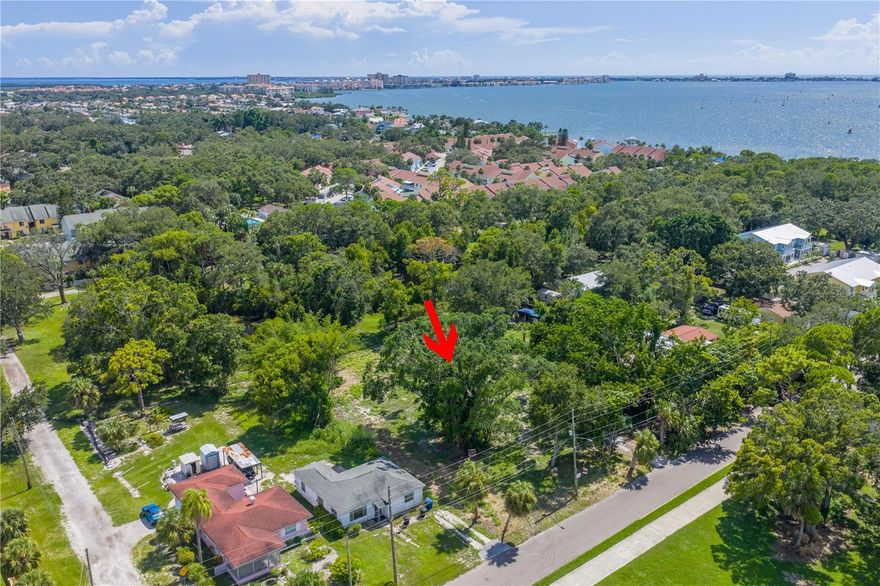 This prime 31,429 sq ft buildable lot offers an exceptional development opportunity in one of St. Petersburg’s most unique natural settings. Just steps from the scenic Clam Bayou Preserve, the property provides direct access to the kayak and paddleboard launch, as well as the bike and walking trail that winds through the preserve’s lush mangroves and waterways. The lot itself offers remarkable flexibility—developers can split it into three single-family home lots, build up to eleven townhomes, or maximize its potential with as many as twenty-two townhomes if designated for affordable housing. Beyond its development options, the location provides a rare blend of recreation and convenience, where future residents can enjoy kayaking, paddleboarding, birdwatching, and cycling right outside their door, all while being minutes from Gulfport, downtown St. Pete, and the beaches. This is a truly unique opportunity to create a boutique community or collection of private residences in a thriving and highly desirable area.