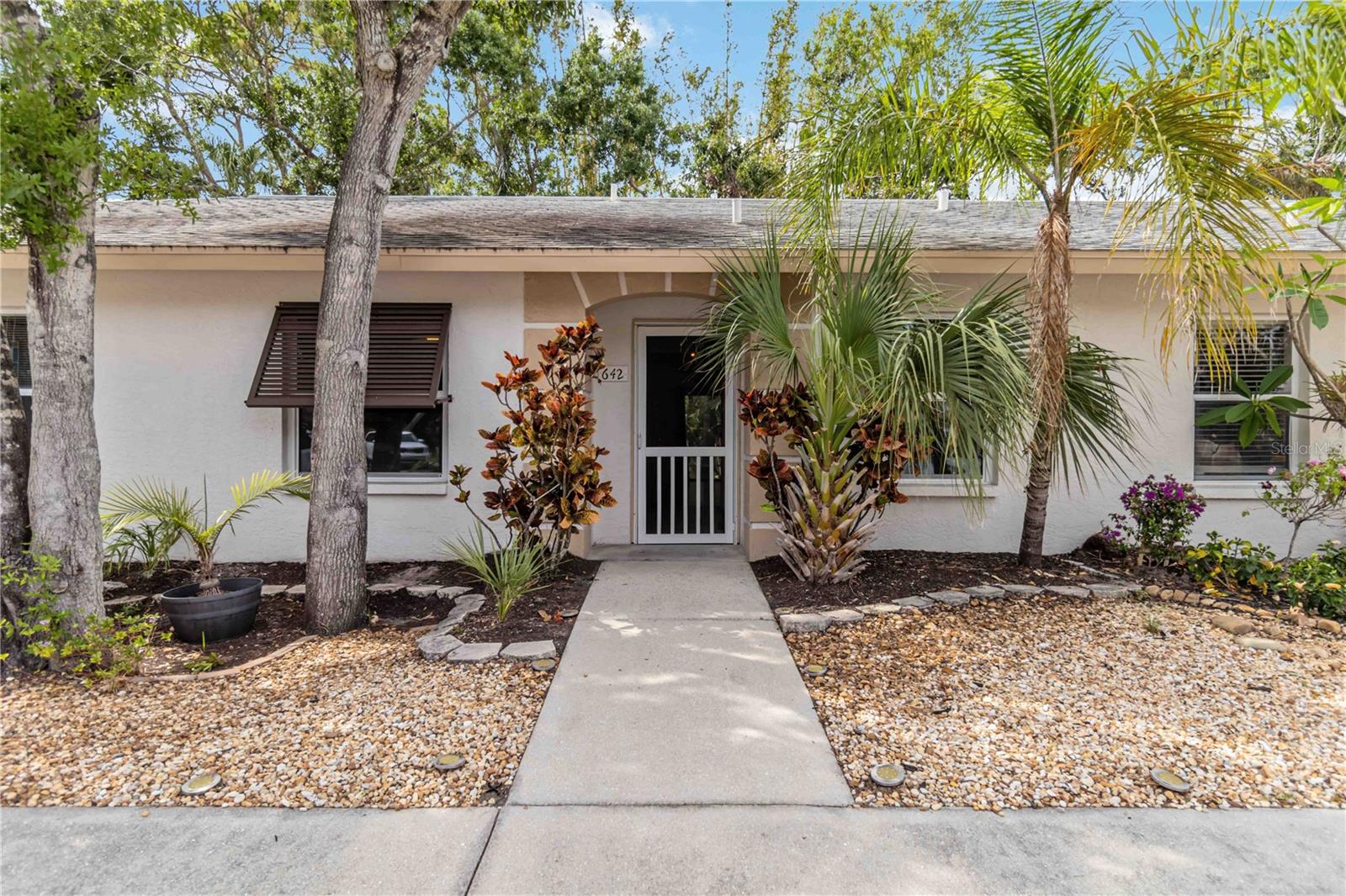 Beautiful Bermuda Park Condo – Also offered for sale (MLS #A4651611). Vaulted Ceilings, Private Lanai & Prime Sarasota Location Welcome to 642 N Jefferson Ave, a bright and spacious 2-bedroom, 2-bathroom condo located in the desirable Bermuda Park community in Sarasota. Situated in one of the newer buildings in the complex, this home combines comfort, privacy, and an unbeatable location. Step inside to soaring vaulted ceilings and an open-concept layout filled with natural light, thanks to two new PGT hurricane impact windows. The kitchen boasts stainless steel appliances, ample cabinet space, and a breakfast bar perfect for entertaining or everyday living. Enjoy peaceful mornings on the private screened lanai overlooking lush greenspace—a perfect retreat with no rear neighbors. The unit also features in-unit laundry, two reserved parking spaces, and additional guest parking. Location is everything, and this condo delivers with easy access to Downtown Sarasota, St. Armands Circle, and Lido Beach—all just a short ride away on the Breeze Trolley. Whether you're heading to the beach, shopping, dining, or cultural events, you're perfectly positioned to enjoy the best of Sarasota. Bermuda Park offers a quiet, well-maintained environment with low HOA fees, making it ideal for year-round living or a seasonal getaway. Don’t miss this opportunity to own a stylish, centrally located condo in the heart of Sarasota!