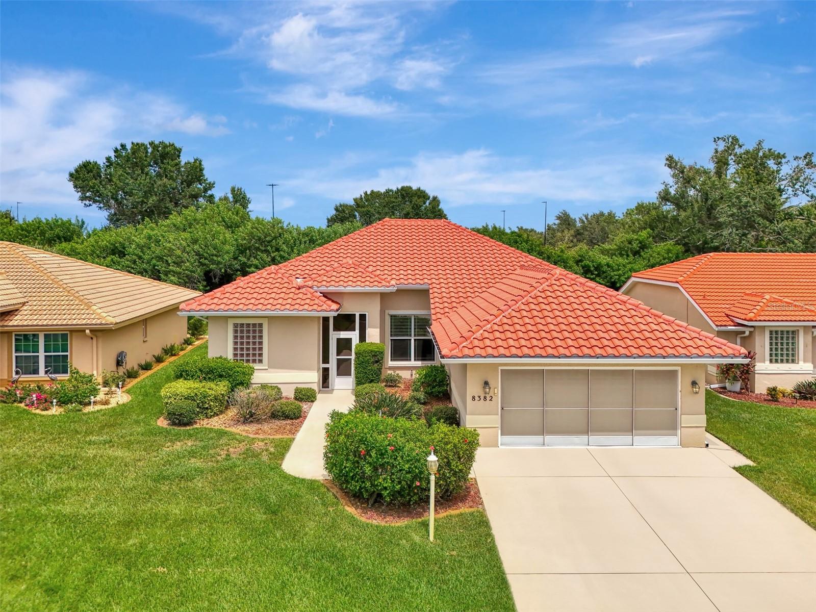 Beautiful Home in Oyster Creek Golf Community – Move-In Ready with Modern Updates! This well-kept 3-bedroom, 2-bath home with a 2-car garage is full of charm, comfort, and convenience. Located in the popular gated golf community of Oyster Creek, this home offers the perfect blend of relaxing living and active lifestyle—all just minutes from Englewood Beach and local shops and restaurants.Step inside and you’ll love the bright and open layout. High vaulted ceilings and large windows create a light and airy feel throughout the main living space. The kitchen is perfect for cooking or gathering with guests, featuring a large breakfast bar, decorative tile backsplash, and tons of counter and cabinet space. It opens right into the living and dining areas for easy flow. The spacious primary bedroom has two walk-in closets and a private bath with dual sinks, a walk-in tile shower, and separate toilet room. You’ll enjoy direct access from the primary suite, living room, or dining area to the oversized Florida Room—a vinyl-enclosed space that lets you enjoy the beautiful greenbelt views year-round, rain or shine. Both guest bedrooms come with built-in closets and ceiling fans, while the guest bath offers a tub/shower combo and vanity with solid surface countertop! The indoor laundry room is roomy and practical, complete with washer, dryer, utility sink, and built-in closet for extra storage space. Outside, the curb appeal shines. A new tile roof (2023) and new A/C (2022) give peace of mind, while the well-landscaped yard features mature palm trees, rock accents, and concrete curbing for a neat, polished look. Living in Oyster Creek means you can enjoy the heated community pool, spa, fitness center, pickleball, and tennis courts, with golf available—but not required. Cable, internet, and exterior maintenance are included with the HOA, so you can spend more time enjoying life. This home has everything you need for relaxed, easy Florida living—don't miss your chance to make it yours!
