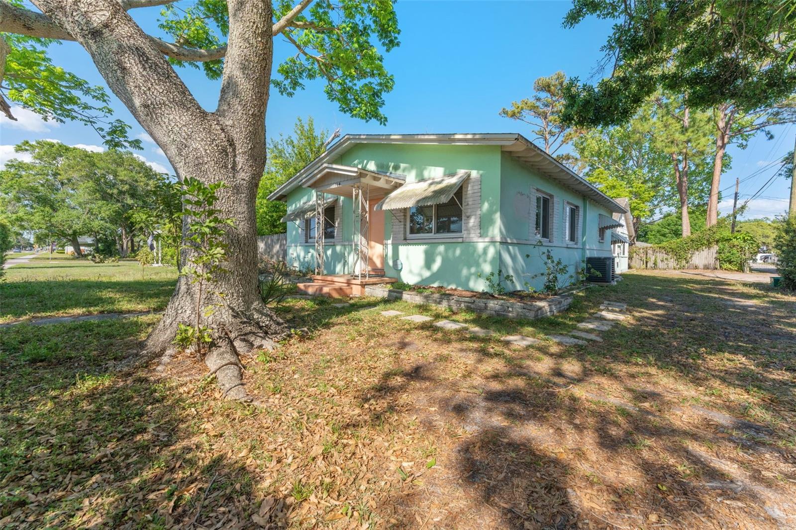 DUPLEX ALERT! Welcome to 1604 58th Street S, a vibrant mid-century duplex in the heart of Gulfport that’s full of charm, character, and income potential. This solid block property offers two separate 2-bedroom, 1-bath units, each with its own private entrance, unique style, and artistic flair. The front unit features bold colors, stained concrete floors, a retro kitchen, and a vintage tiled bath. The back unit has a cozy cottage vibe with mid century pink cabinetry, wood-paneled walls, and an updated bathroom with a walk-in shower.
Both units are bright and spacious, featuring a newer roof (2023), central HVAC (2017), newer on-demand water heaters (2018), and have ample storage. The fully fenced yard offers space to relax, garden, or entertain, and there’s a long driveway for off-street parking. Each unit is separately metered, with shared laundry and multi-family zoning, making it perfect for house-hacking, long-term tenants, or short-term rental use. Located just minutes from Gulfport Beach, the waterfront district, art walks, and downtown St. Pete, this is your chance to own a truly unique income property in one of Pinellas County’s most beloved neighborhoods.
If you're looking for a property that’s anything but cookie-cutter, 1604 58th Street S delivers style, soul, and serious income potential. Schedule your showing today and step into a slice of Florida charm that’s bursting with possibility.