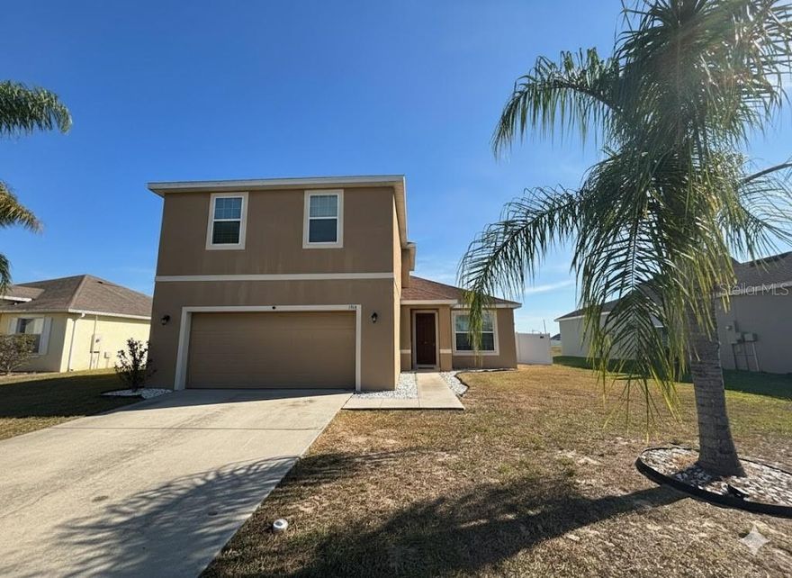 One or more photo(s) has been virtually staged. Now available in Lake Alfred: a spacious 4-bedroom, 2.5-bathroom two-story home with room to spread out and settle in. The main bedroom and en-suite bath are conveniently located on the first floor, offering privacy and ease of access, while three additional bedrooms and a full bath await upstairs—perfect for family, guests, or a home office setup. Downstairs, the open-concept kitchen and living room area create a seamless flow for entertaining or relaxing. Step outside to enjoy a fully fenced backyard, ideal for pets, play, or weekend BBQs. This home combines comfort, functionality, and location—don’t miss your chance to make it yours.