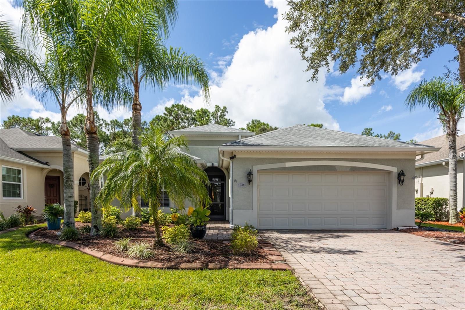 LPGA International, the premier golf club of Daytona Beach, boasts 36 holes of world-class golf designed by Arthur Hills and Rees Jones. This well-maintained home features 12' ceilings, an office that can serve as a third bedroom, and a kitchen with maple cabinets and custom pantry. Updates include a new roof and HVAC (2019), new carpet and water heater (2022), and fresh interior paint. Enjoy upgraded closets, a monitored security system, and lawn care included by the association. Relax on the screened porch with golf cart access to the practice facility. Move in Ready!