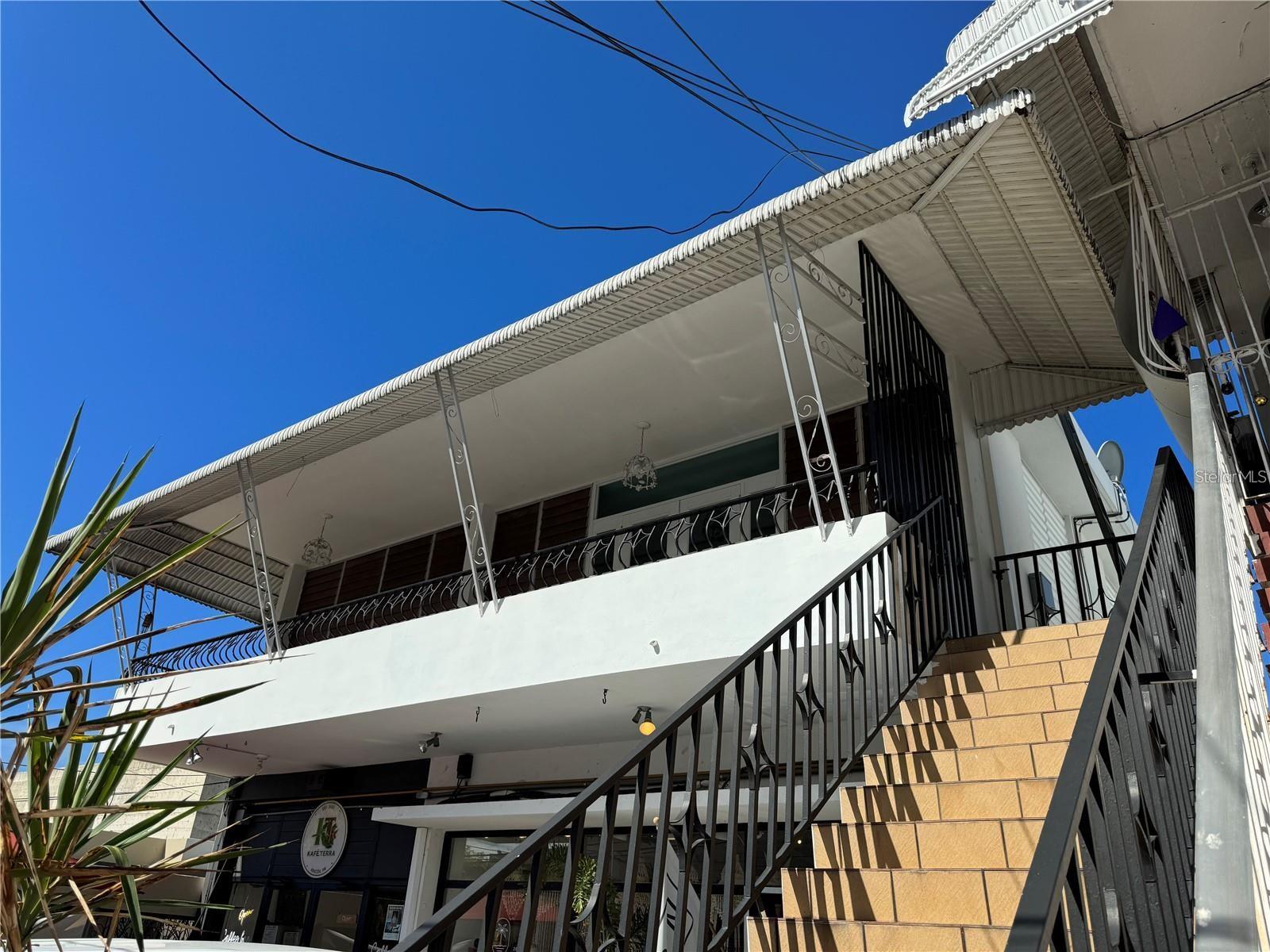 Move into an up-to-date urban apartment overlooking the Plaza in downtown Rincon. See all the action from this second-floor unit and enjoy the quick walk to everything in this quaint beach town. This unit has two bedrooms and one bath, with a large living room, kitchen, and dining area. You will enjoy the ocean breezes from the balcony above the town plaza.