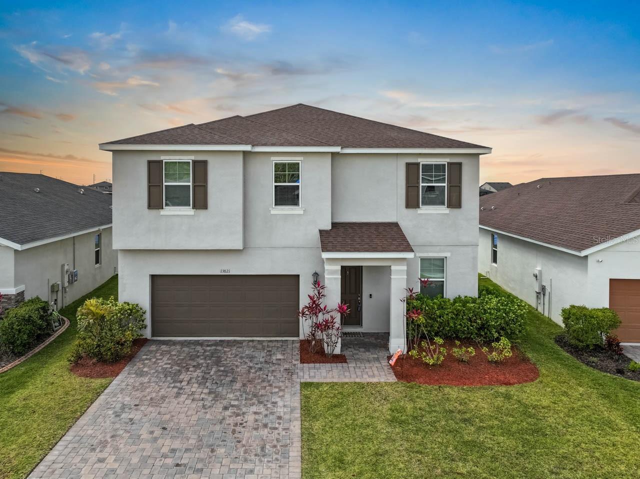 4-Bedroom, 2.5-Bath Home with Sunset Water View! Welcome to this beautiful 2-story home, offering a spacious layout perfect for modern living. The downstairs features an open and inviting kitchen with elegant quartz countertops, 42-inch cabinetry, and stainless steel appliances—ideal for both cooking and entertaining. A set of sliding doors leads out to a screened-in patio, allowing you to relax and take in the stunning pond views and nightly sunsets. The main level also includes a flex room, perfect for an office or study, and a convenient half bath for guests. The open floor plan is finished with stylish tile flooring that complements the home’s overall design. Upstairs, you'll find all four bedrooms, a loft, and a laundry room. The large primary bedroom includes an ensuite bathroom with dual sinks, a step-in shower, an extra-large walk-in closet, and water views. Both upstairs bathrooms feature matching grey quartz countertops and dual sinks for a sleek, modern look. Plush carpeting throughout the upper level adds warmth and comfort. Outside, a large yard provides ample space for outdoor activities, while a spacious driveway leads to the attached 2-car garage. South Fork Community offers a clubhouse with community pool, playground, tennis courts, and activities. Located of of 301 close to retail shops and restraurants. Short drive to Tampa, Sarasota, and St. Pete beaches. Schedule your private showing today.