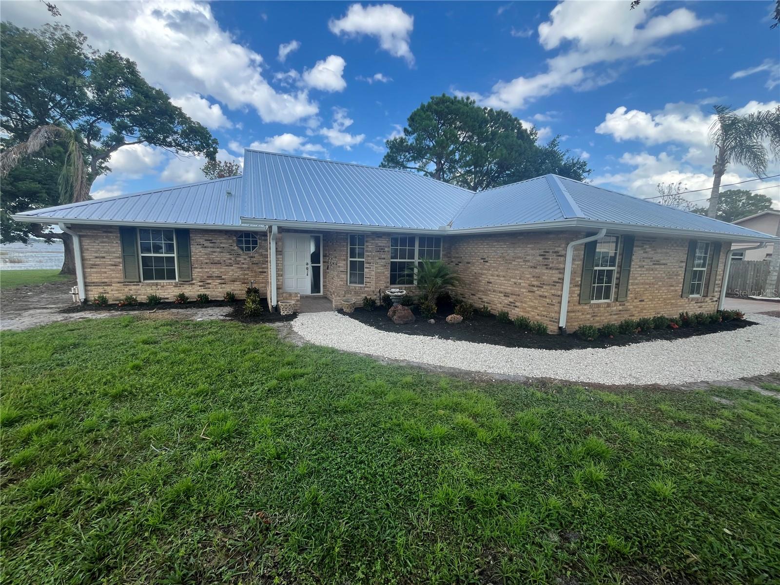Available to show after 09/22. Please see attachments. Fully Renovated 3 bedroom 2 bath split plan home totaling 1,682 sq ft. of living space on lake Theresa. Amenities include a new metal roof with three skylights, new water heater, two car sideloading garage with additional two car carport, two 8 x 10 storage sheds, new baths, new kitchen.