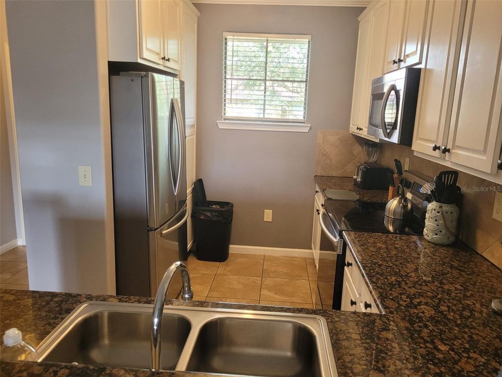 Photo of 910 Charo Parkway #323, Davenport, FL 33897 (MLS # O6342305)